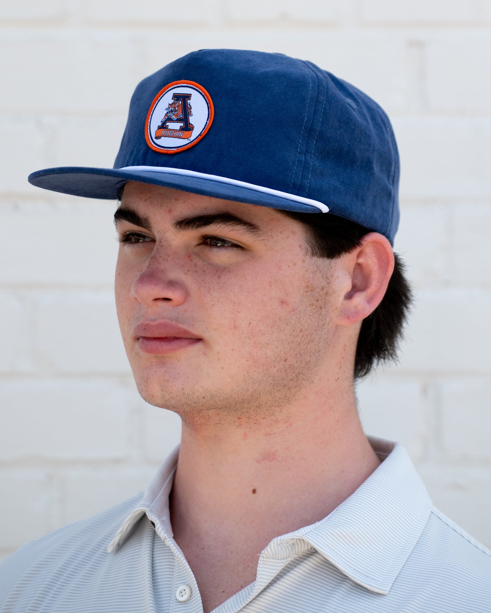 Auburn University Navy Hat with a White rope and a patch of the Leaping Tiger Logo