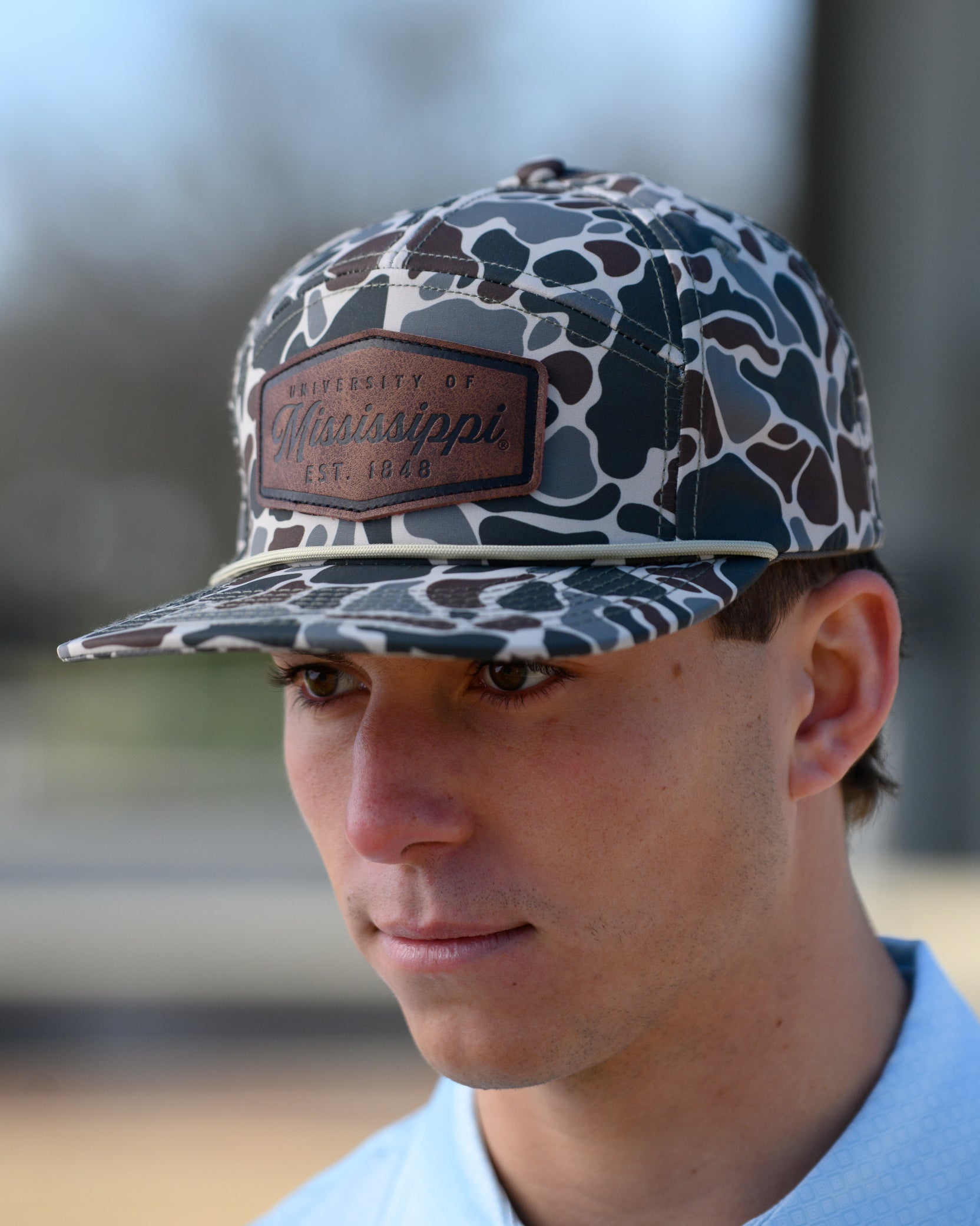 Ole Miss Camo Hat with a Leather patch with text “Mississippi University”