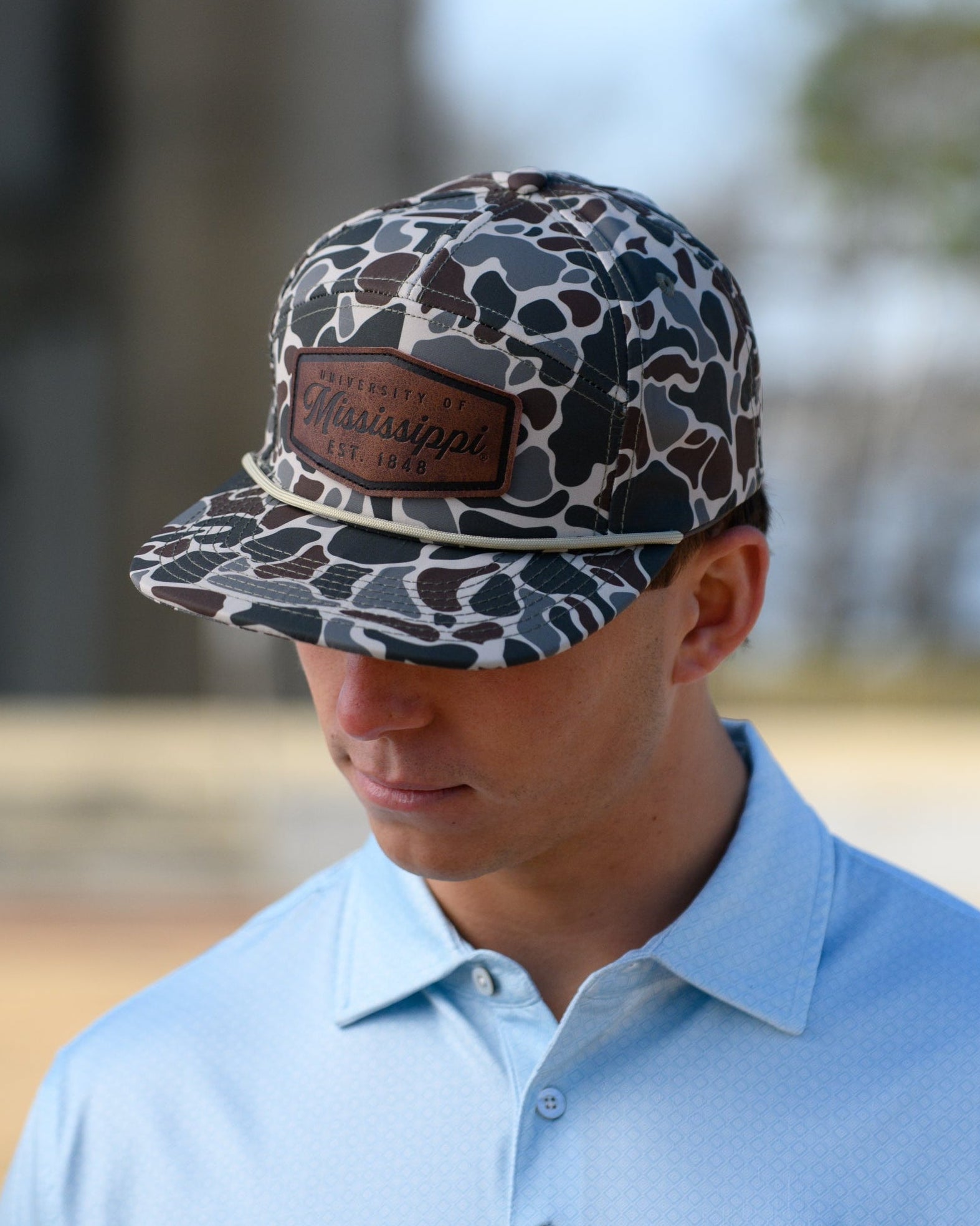 Ole Miss Camo Hat with a Leather patch with text “Mississippi University”