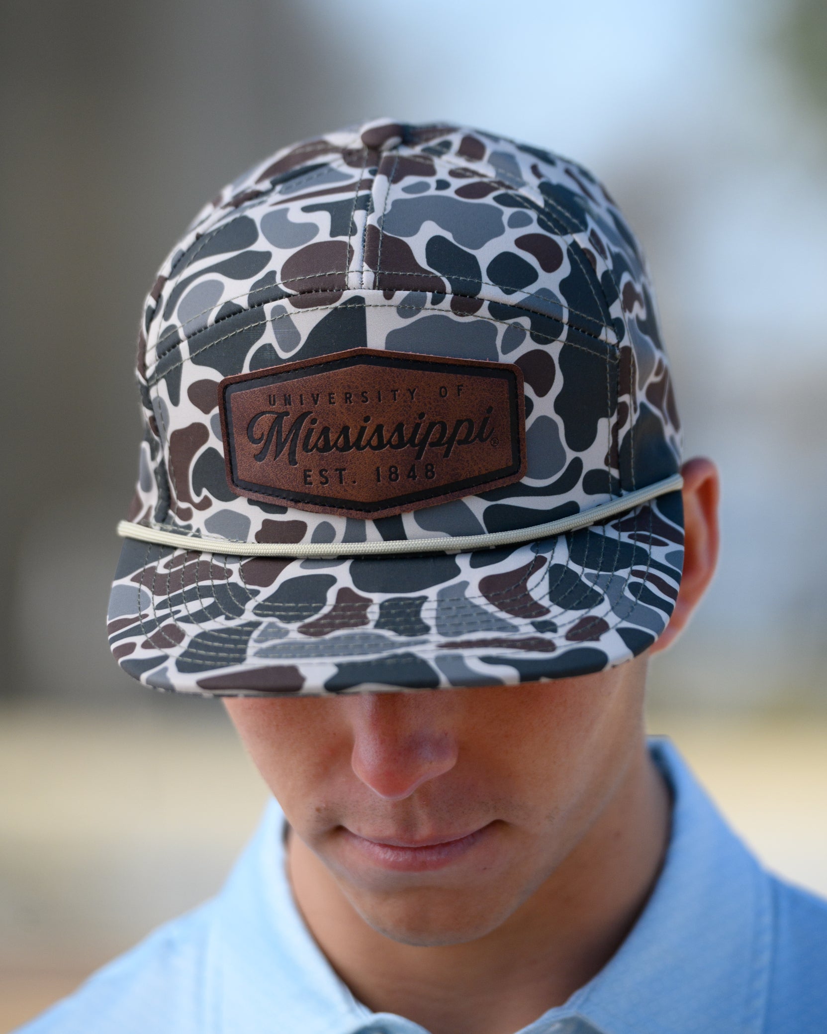 Ole Miss Camo Hat with a Leather patch with text “Mississippi University”