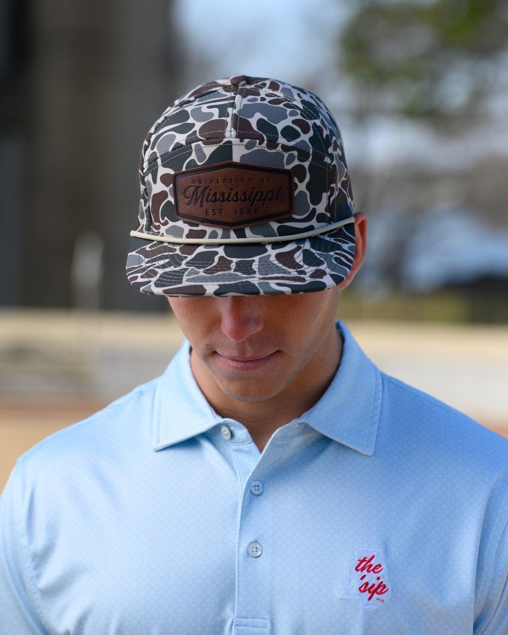 Ole Miss Camo Hat with a Leather patch with text “Mississippi University”