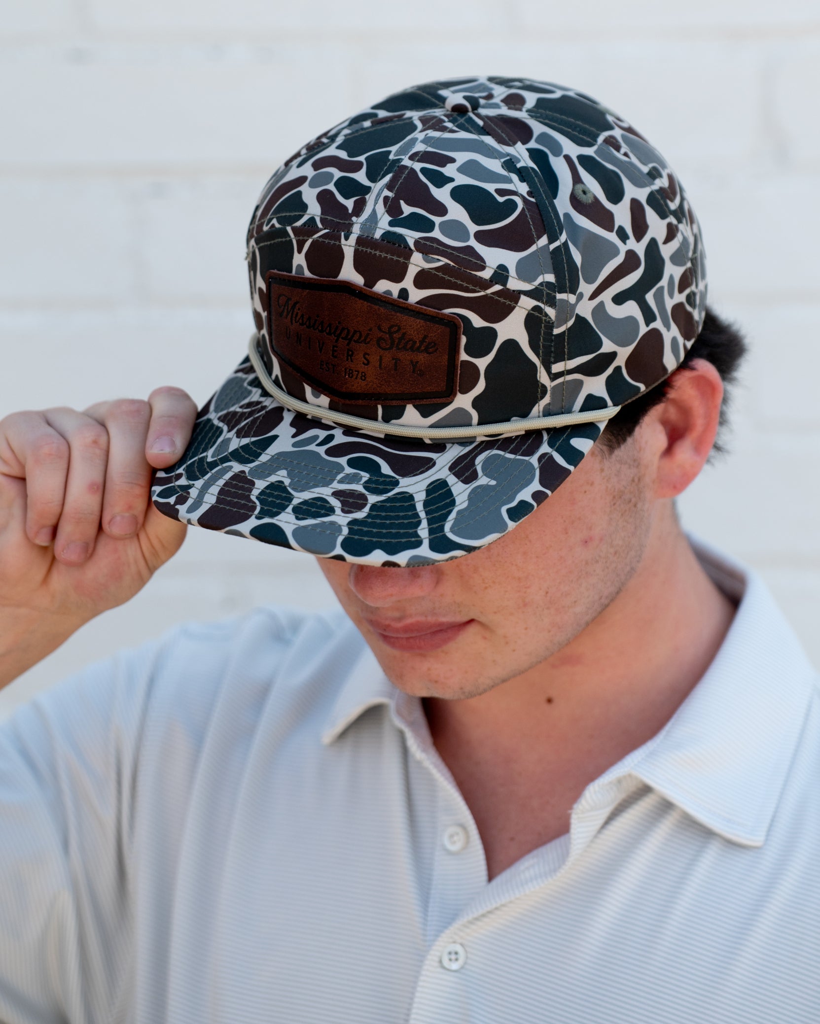 Ole Miss Camo Hat with a Leather patch with text “Mississippi University”