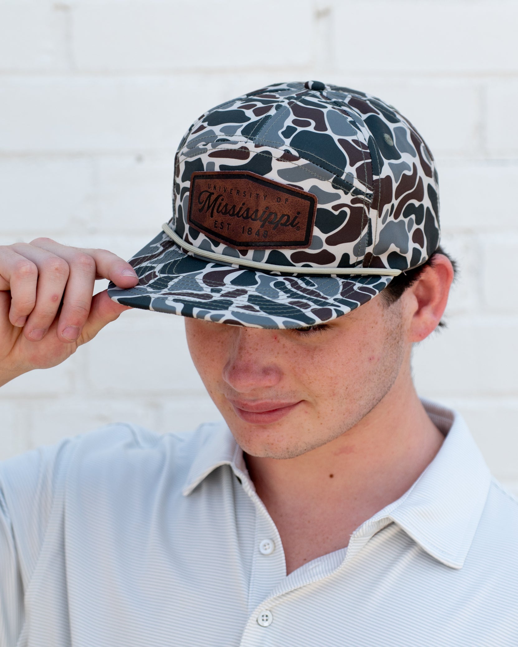 Ole Miss Camo Hat with a Leather patch with text “Mississippi University”