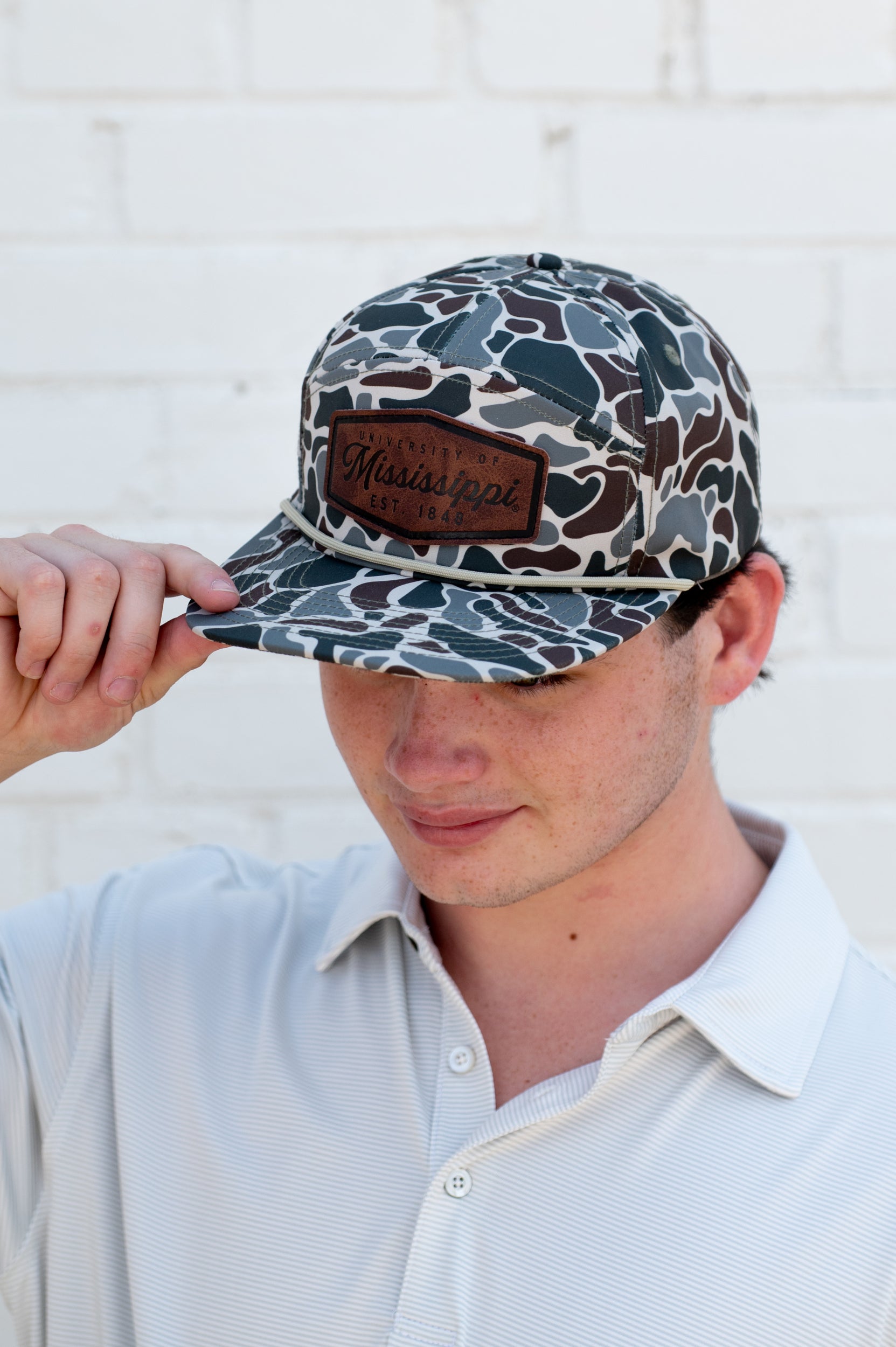 Ole Miss Camo Hat with a Leather patch with text “Mississippi University”