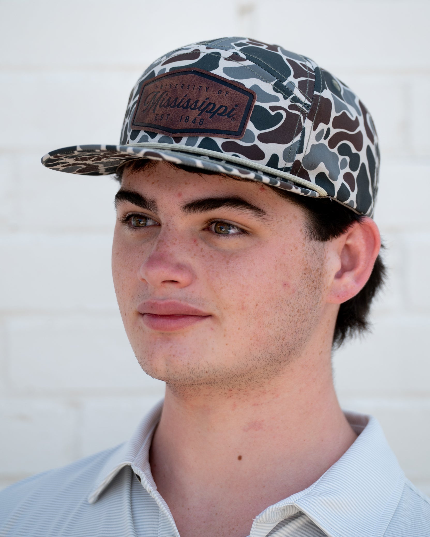 Ole Miss Camo Hat with a Leather patch with text “Mississippi University”