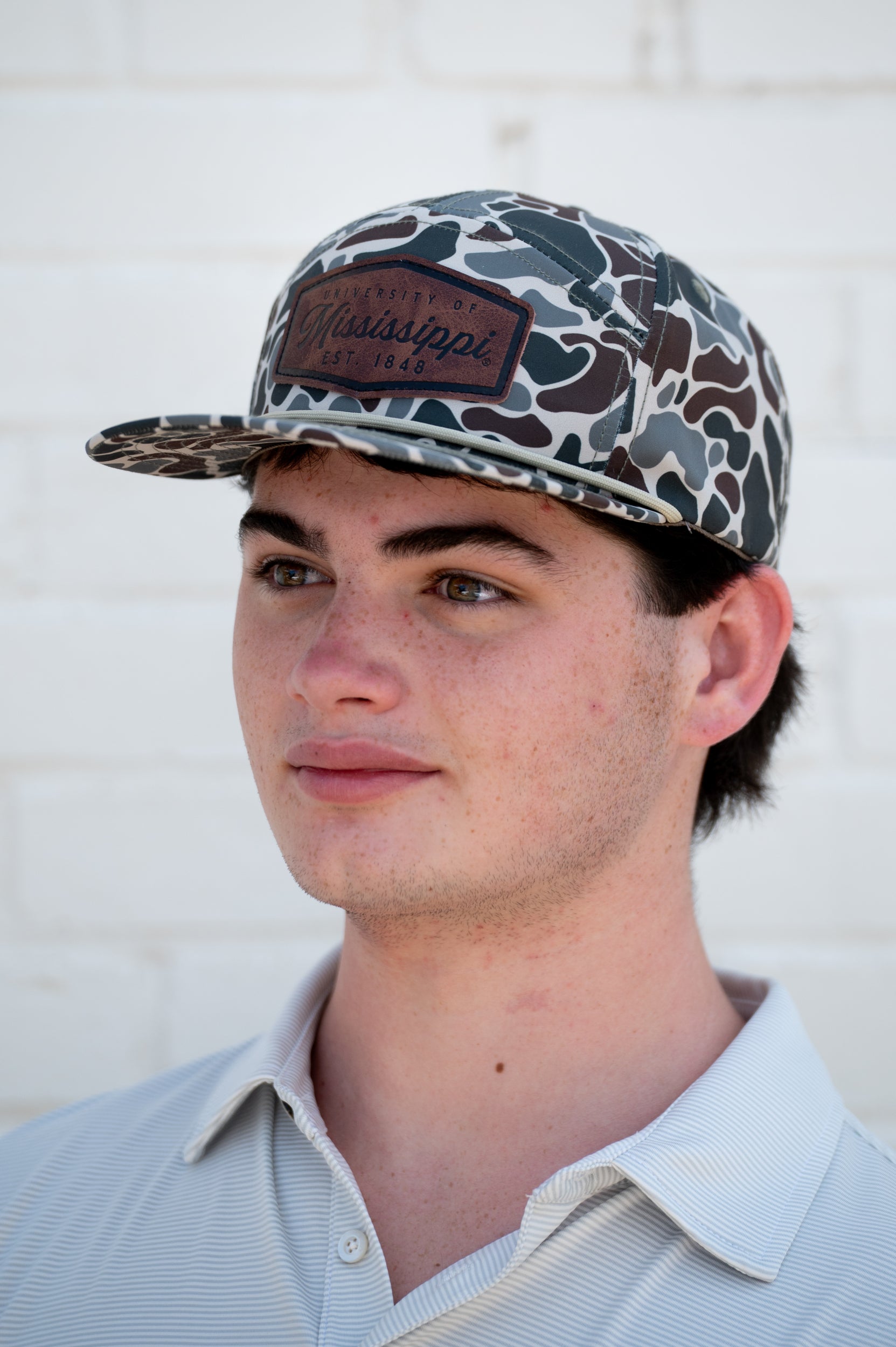 Ole Miss Camo Hat with a Leather patch with text “Mississippi University”