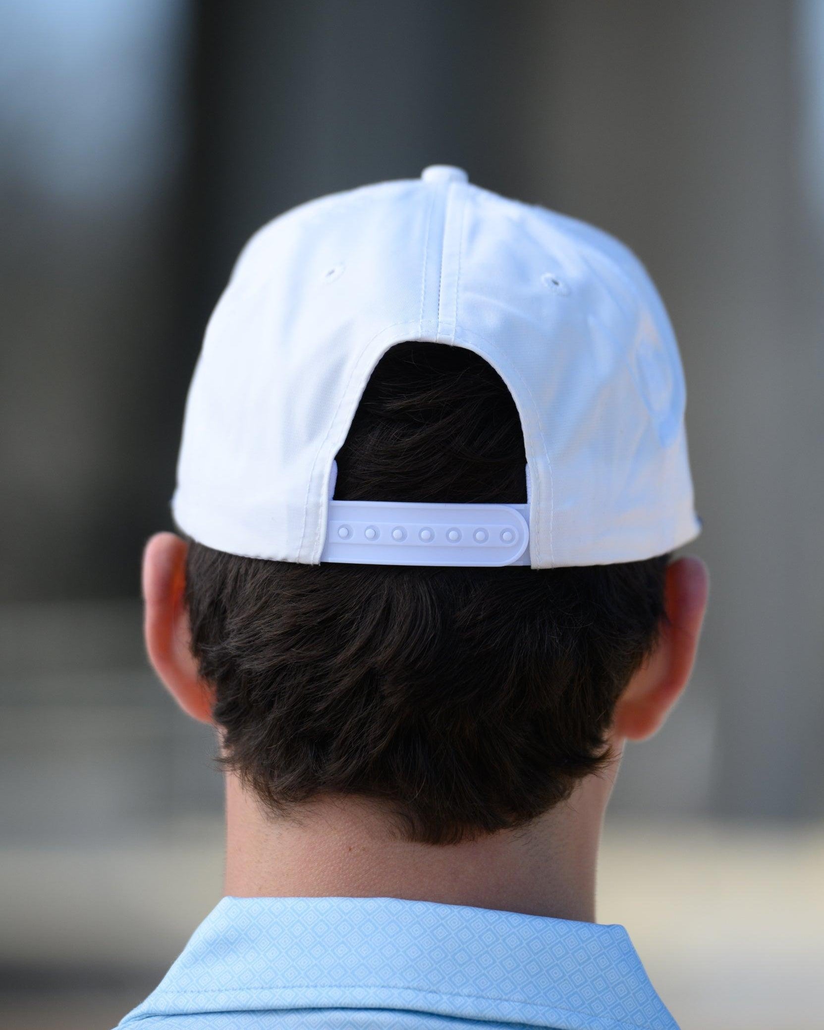 Ole Miss White Hat with Blue embroidery “Ole Miss” with a golf flag representing the “I” in “Miss” snapback hat
