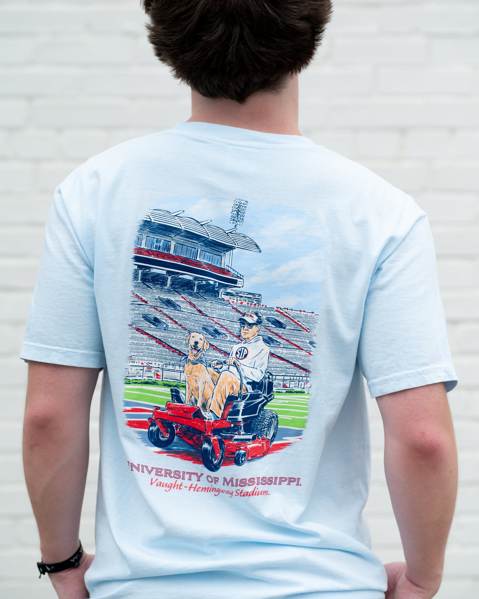 Ole Miss Light Blue Ole Miss Grounds Crew T-Shirt with an image of Lane Kiffin and Juice riding a lawnmower
