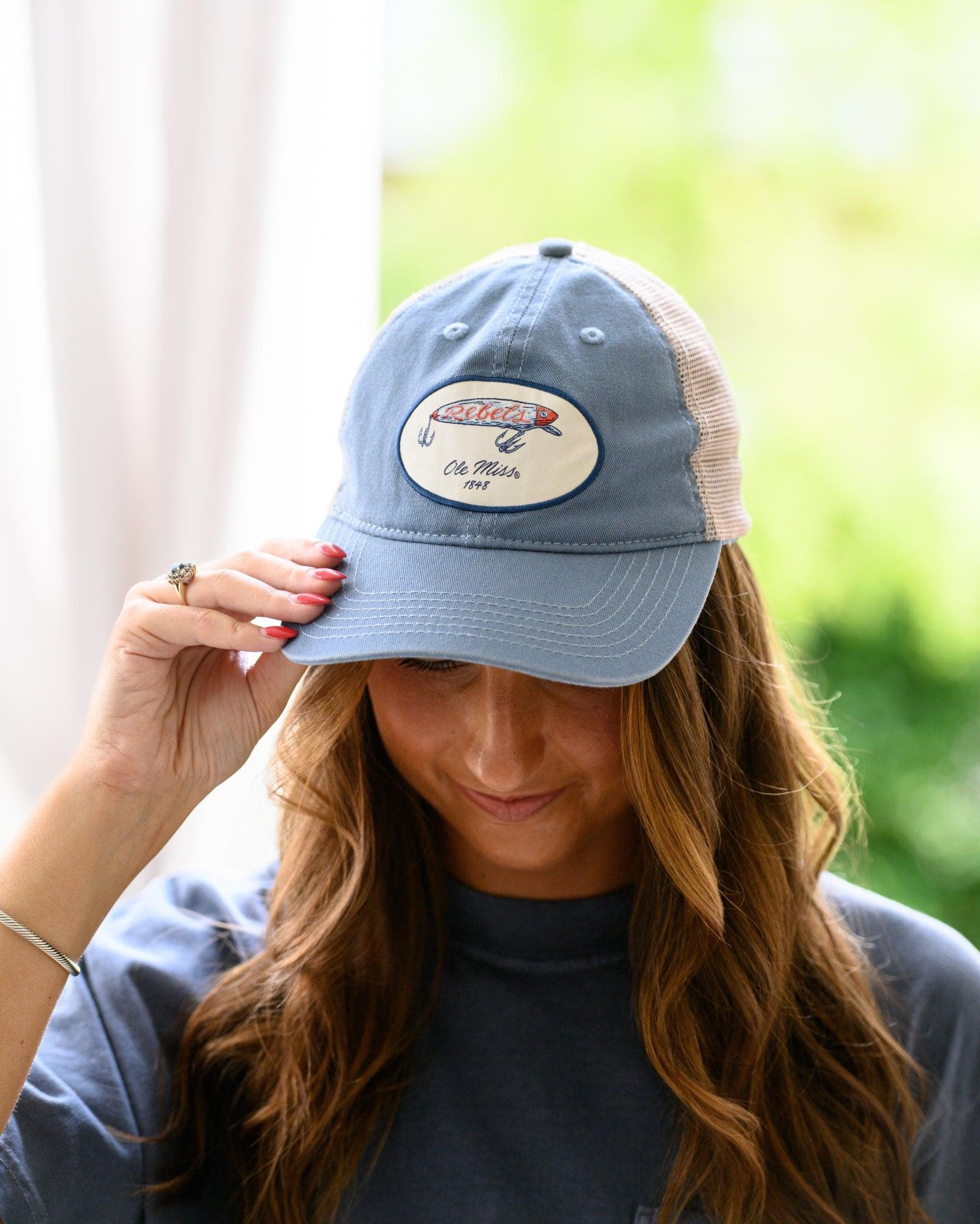 Ole Miss Dusty Blue Hat with a fishing lure with Red script “Rebels”