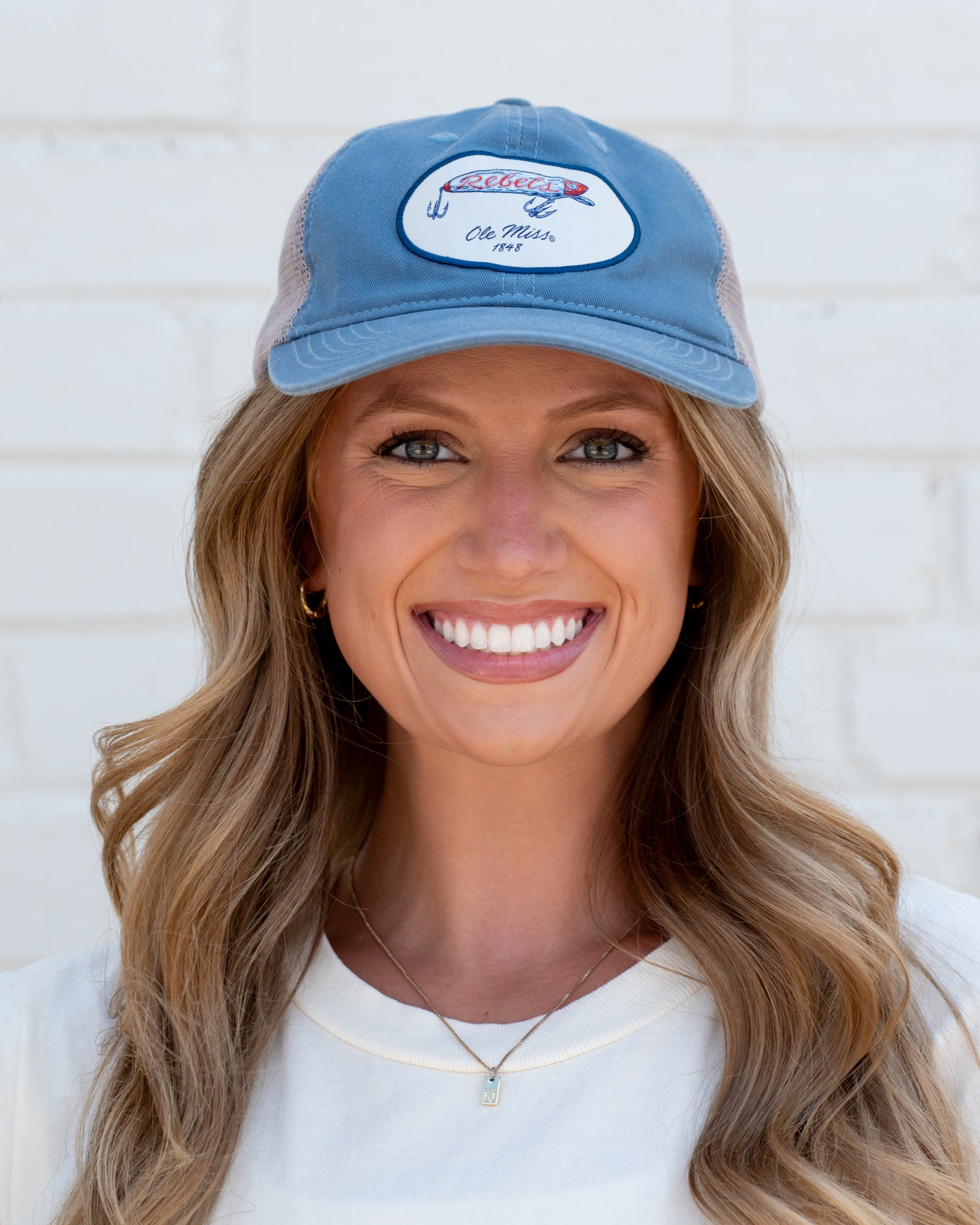Ole Miss Dusty Blue Hat with a fishing lure with Red script “Rebels”