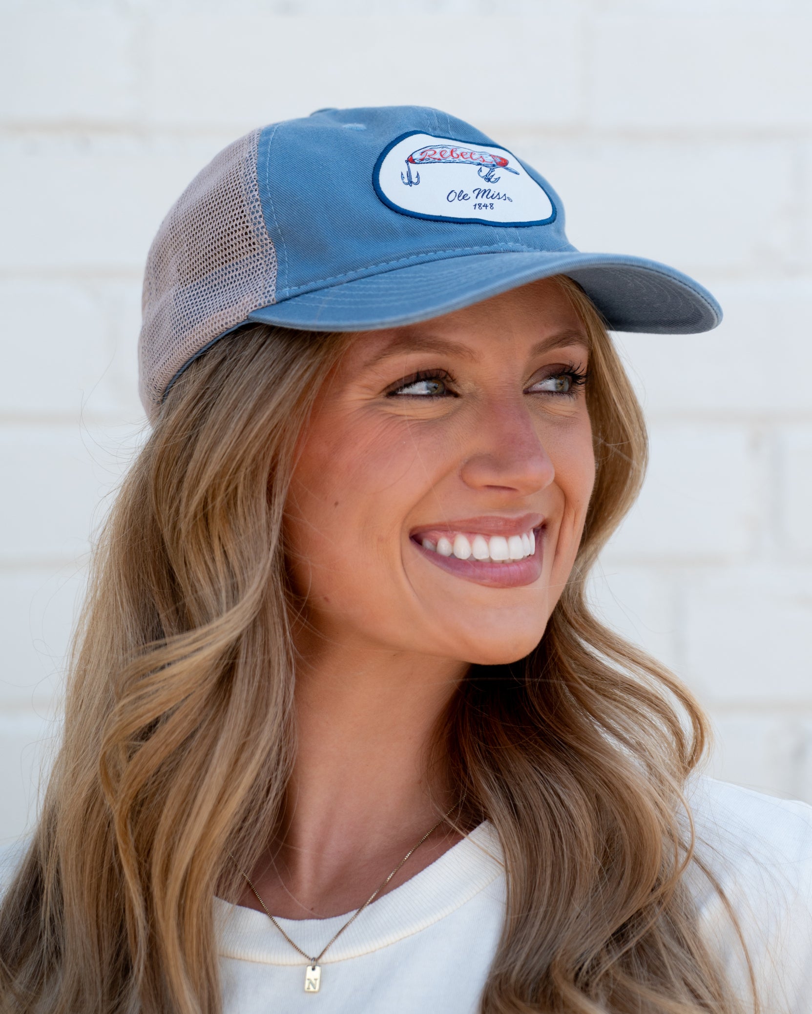 Ole Miss Dusty Blue Hat with a fishing lure with Red script “Rebels”