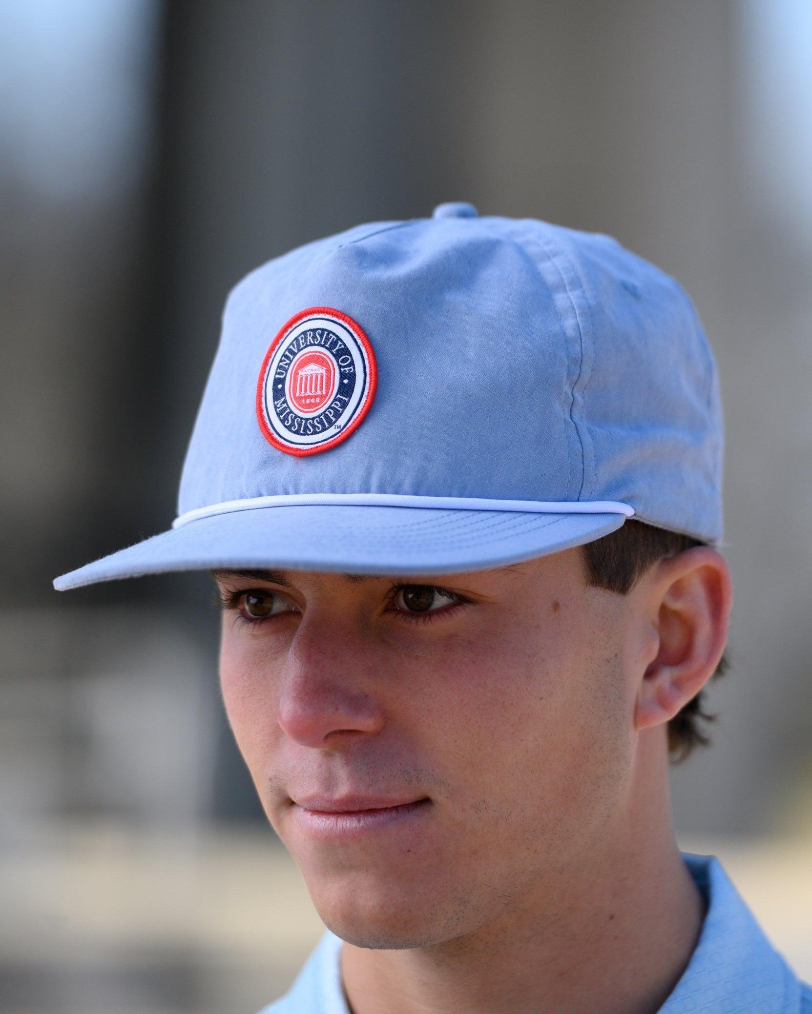 Ole Miss Dusty Blue Hat with a patch of the Ole Miss Seal