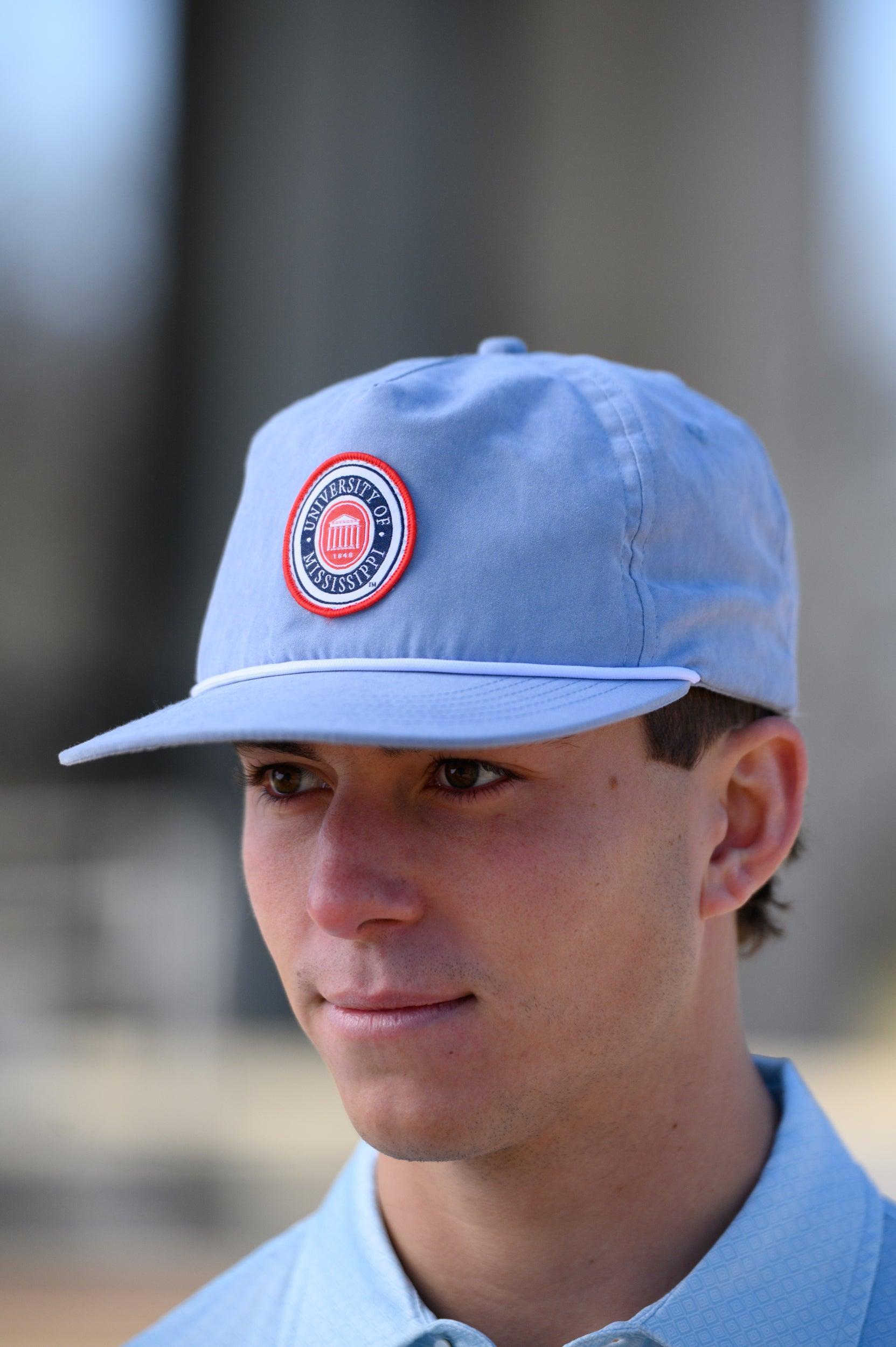 Ole Miss Dusty Blue Hat with a patch of the Ole Miss Seal