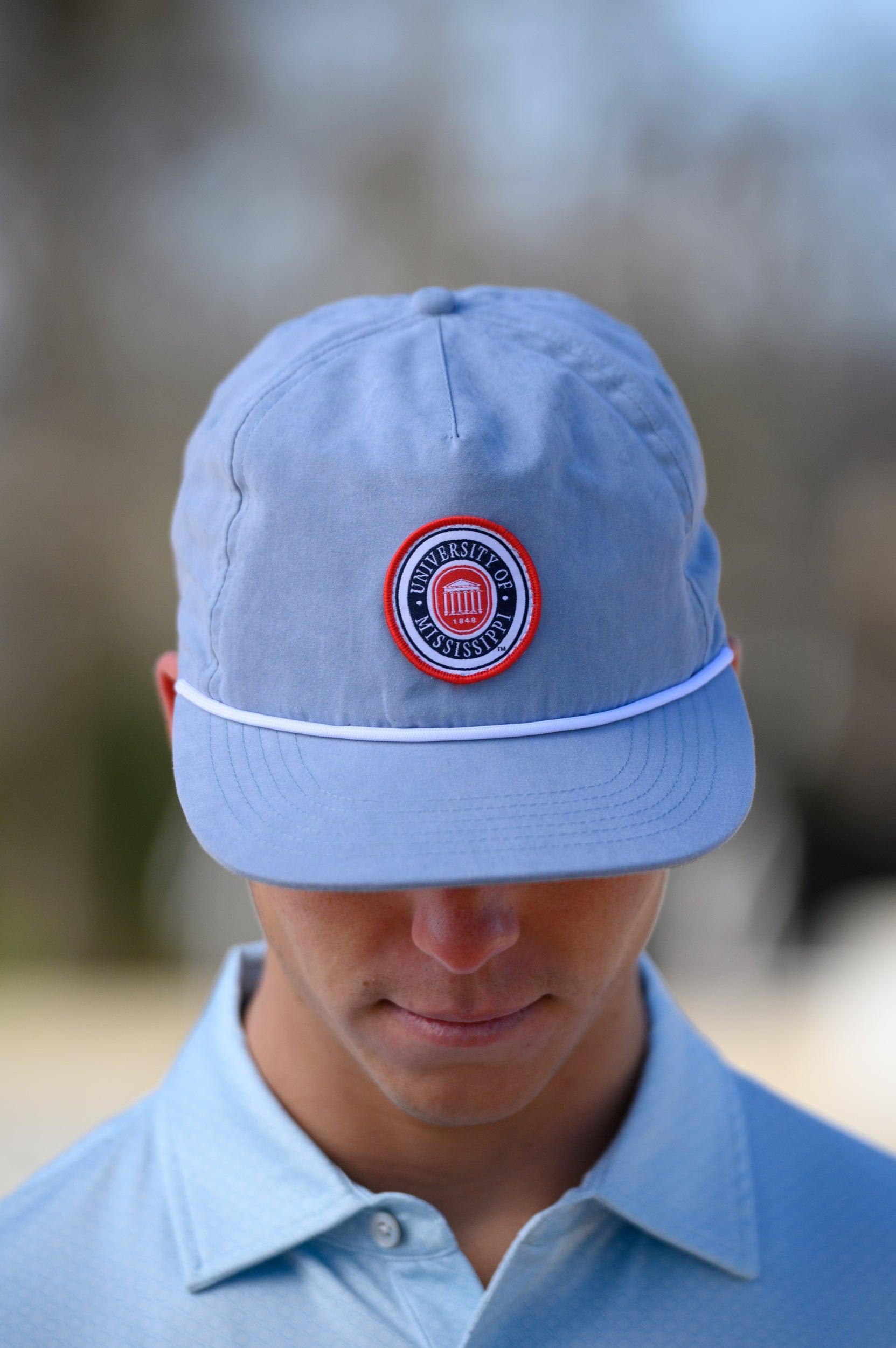 Ole Miss Dusty Blue Hat with a patch of the Ole Miss Seal