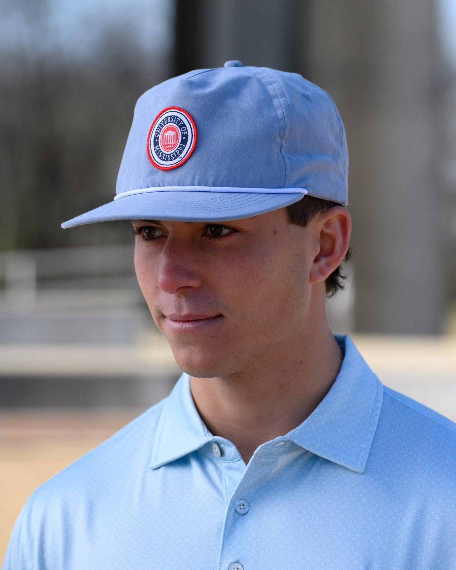 Ole Miss Dusty Blue Hat with a patch of the Ole Miss Seal
