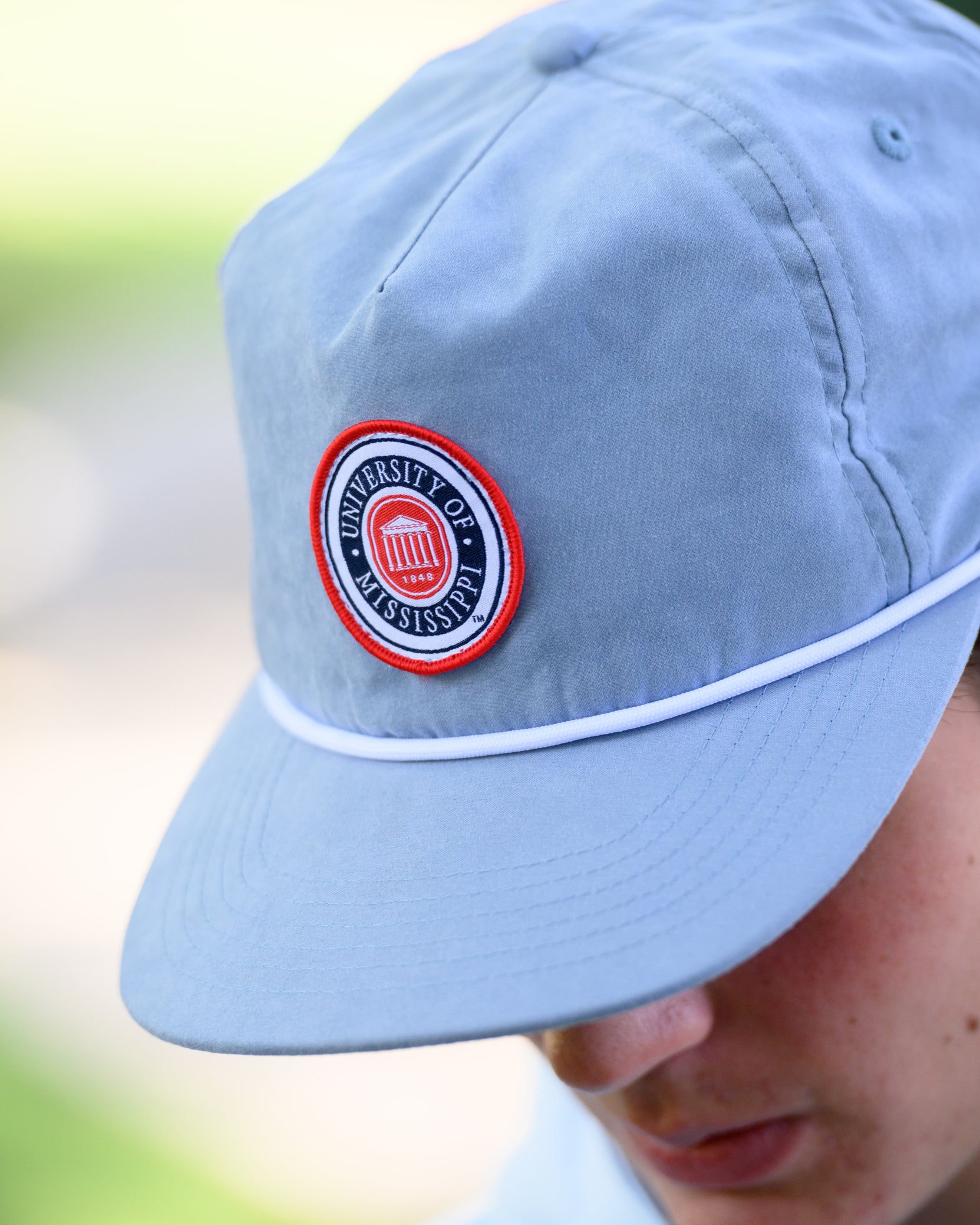 Ole Miss Dusty Blue Hat with a patch of the Ole Miss seal