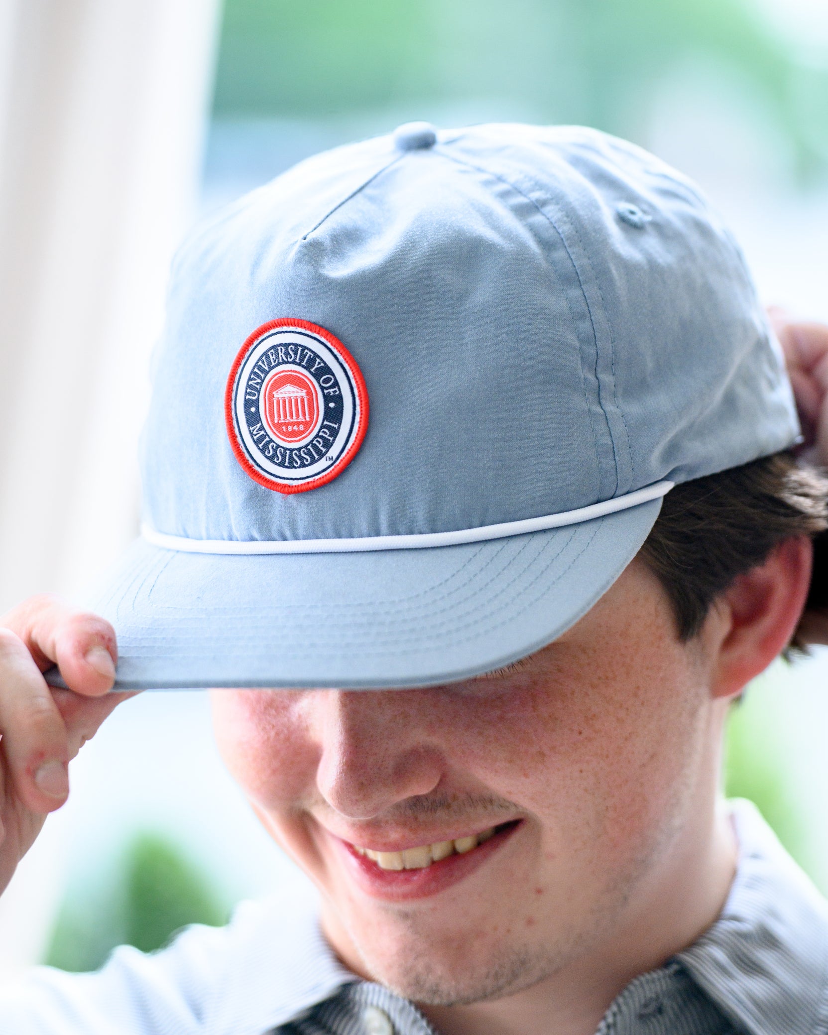 Ole Miss Dusty Blue Hat with a patch of the Ole Miss seal
