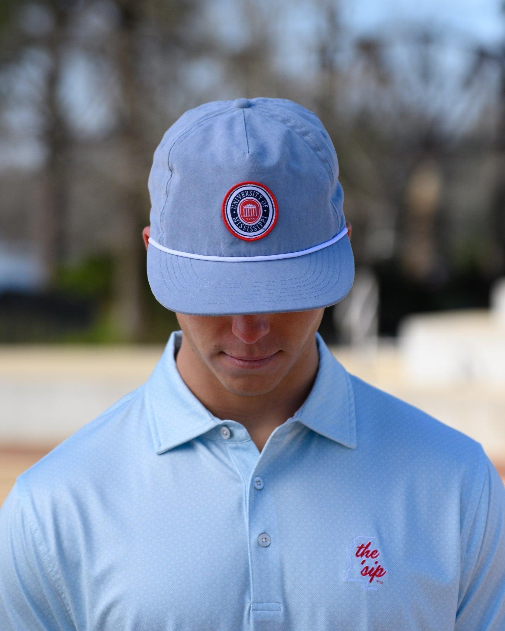 Ole Miss Dusty Blue Hat with a patch of the Ole Miss Seal