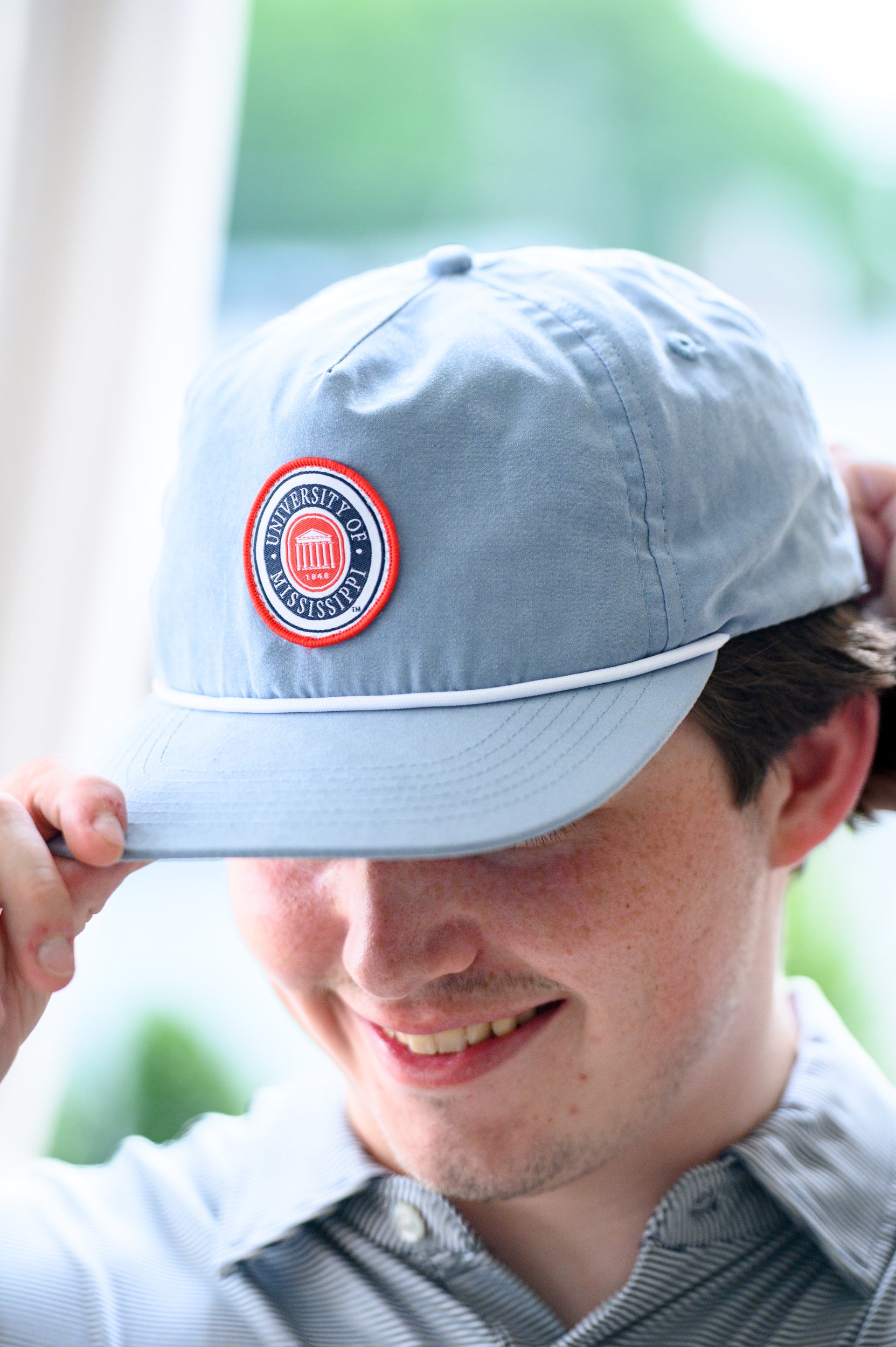 Ole Miss Dusty Blue Hat with a patch of the Ole Miss seal