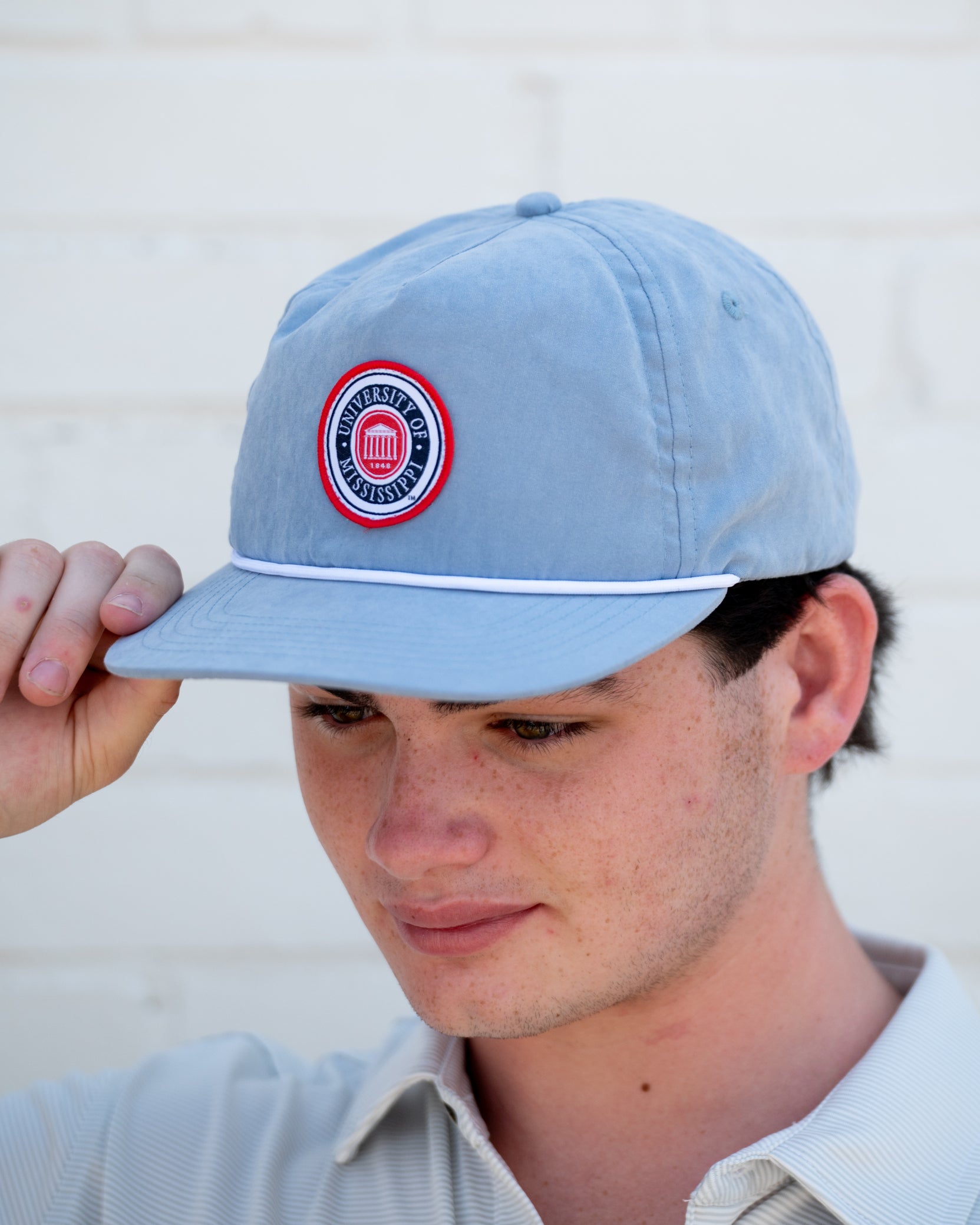 Ole Miss Dusty Blue Hat with a patch of the Ole Miss seal