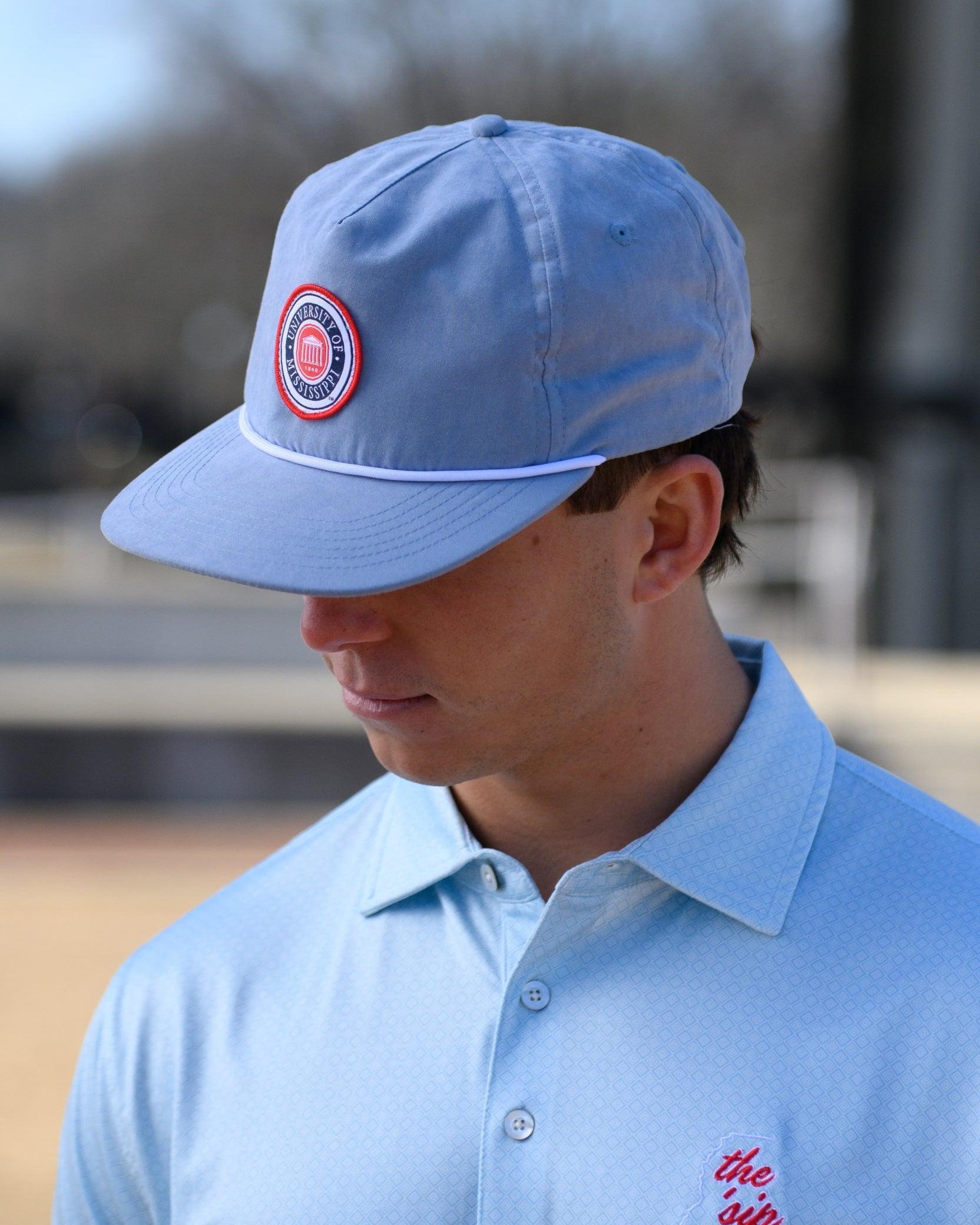 Ole Miss Dusty Blue Hat with a patch of the Ole Miss Seal