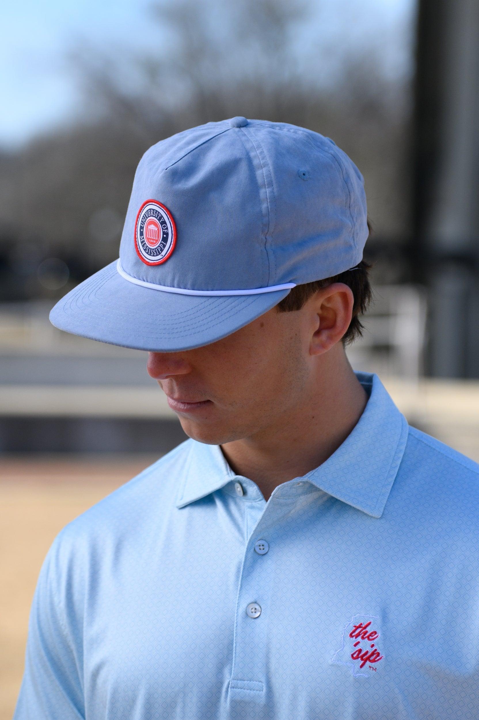 Ole Miss Dusty Blue Hat with a patch of the Ole Miss Seal