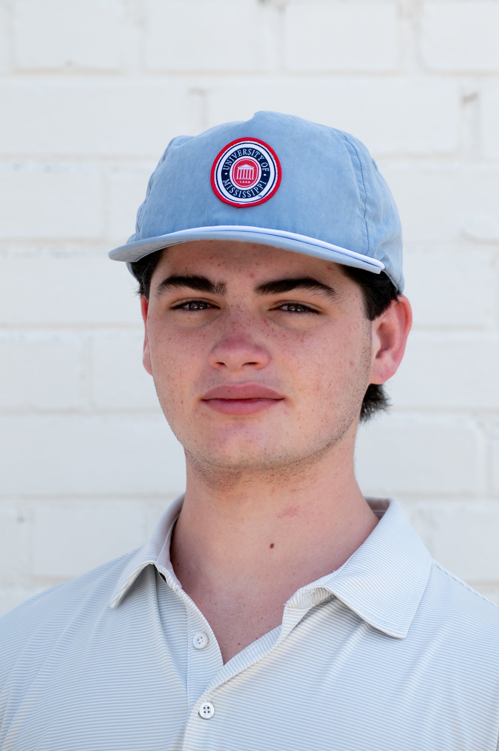 Ole Miss Dusty Blue Hat with a patch of the Ole Miss seal