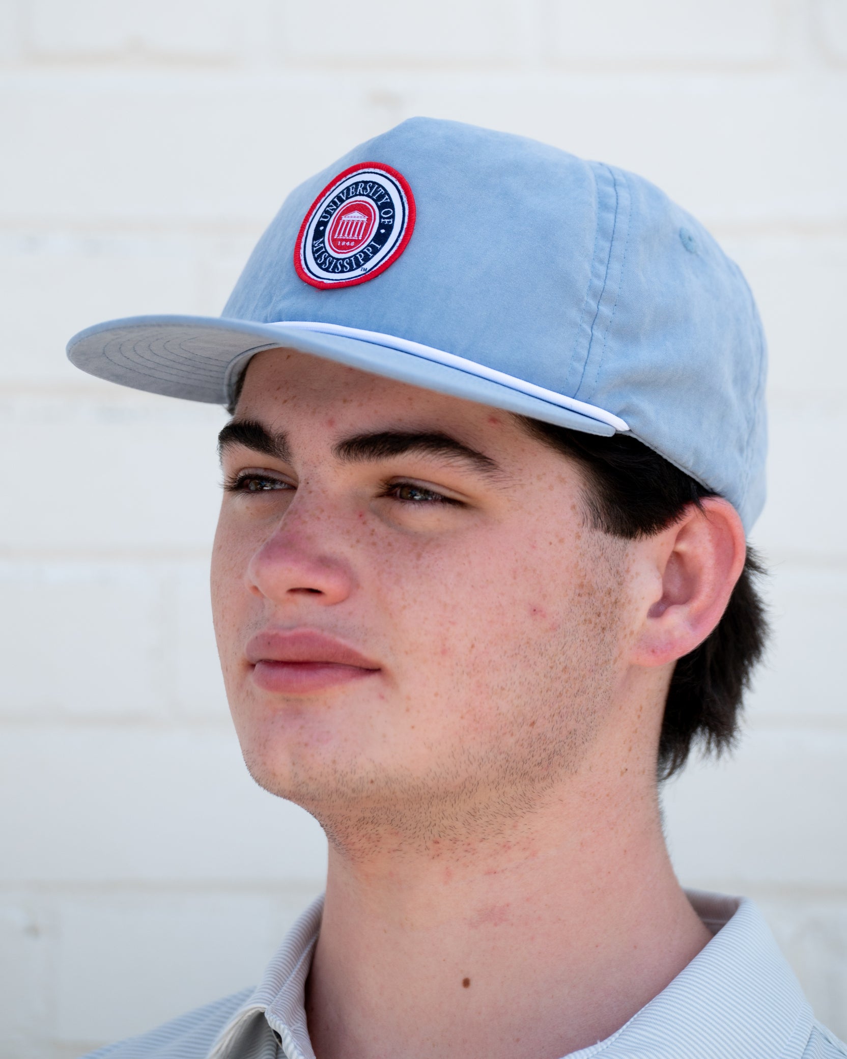 Ole Miss Dusty Blue Hat with a patch of the Ole Miss seal