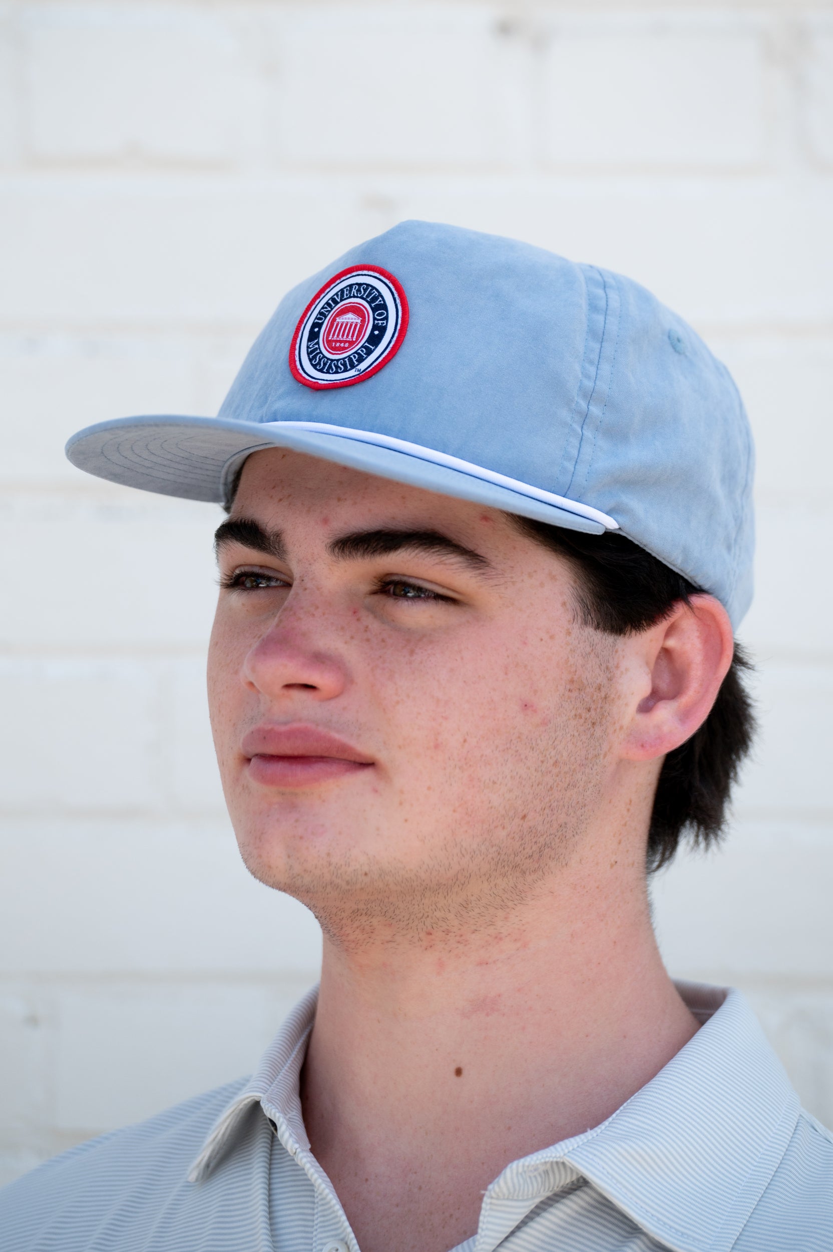 Ole Miss Dusty Blue Hat with a patch of the Ole Miss seal