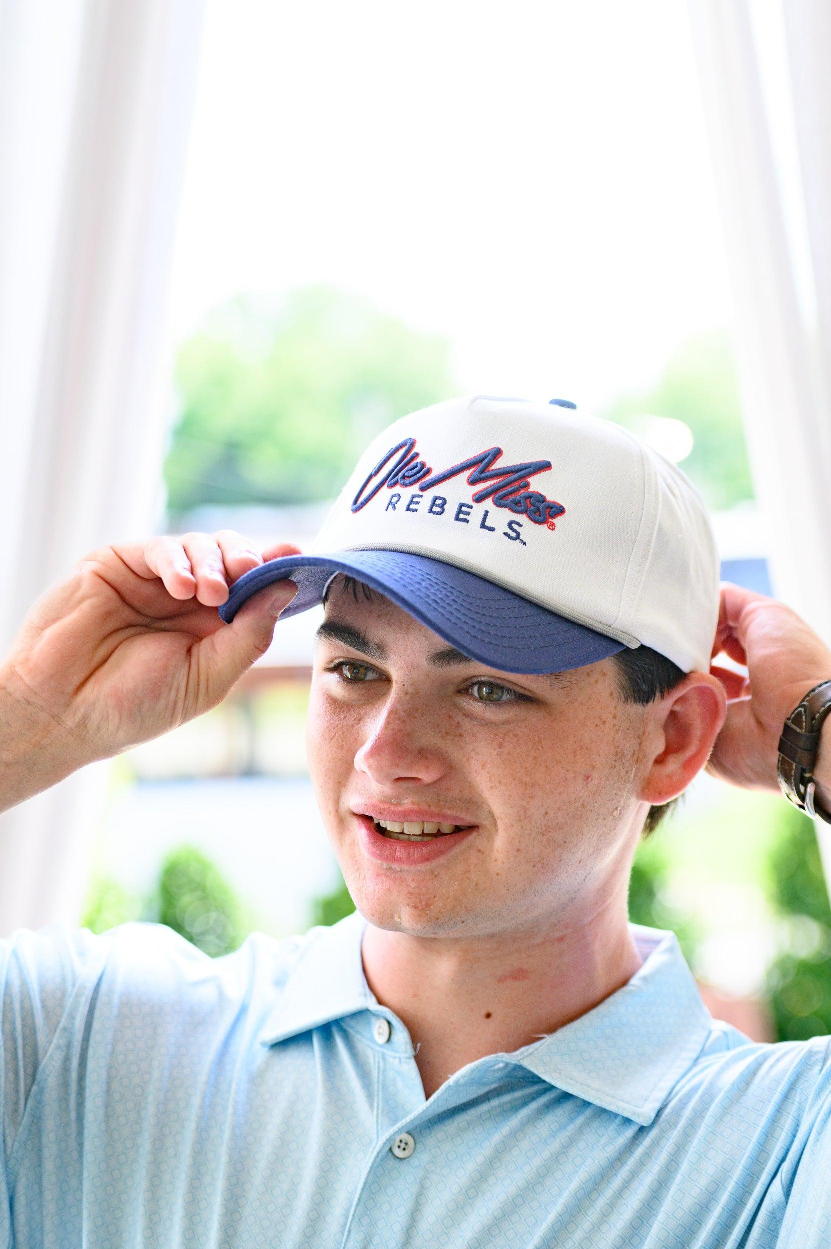 Ole Miss White and Navy Hat with Navy embroidery “Ole Miss” and Navy text “Rebels”