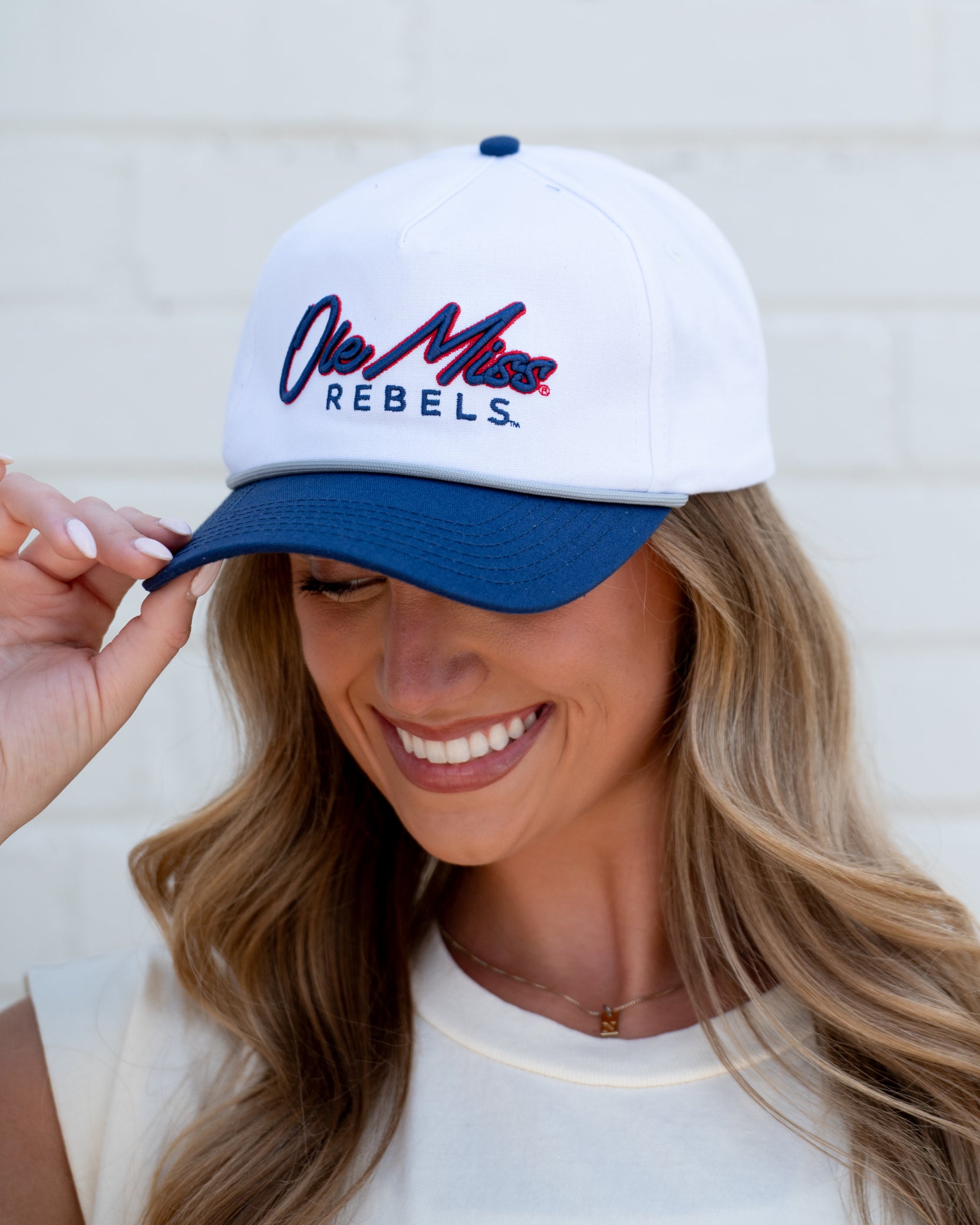 Ole Miss White and Navy Hat with Navy embroidery “Ole Miss” and Navy text “Rebels”