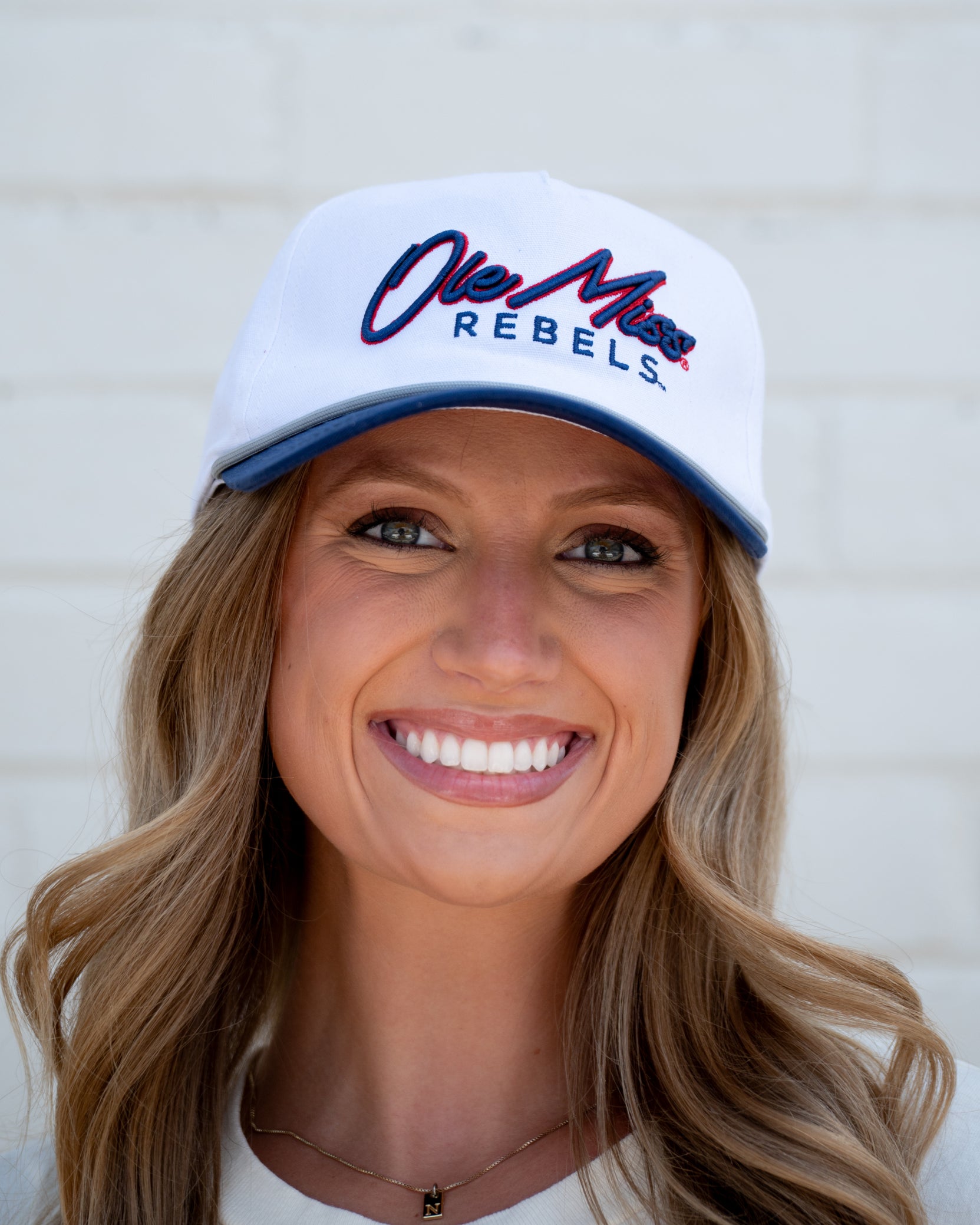 Ole Miss White and Navy Hat with Navy embroidery “Ole Miss” and Navy text “Rebels”