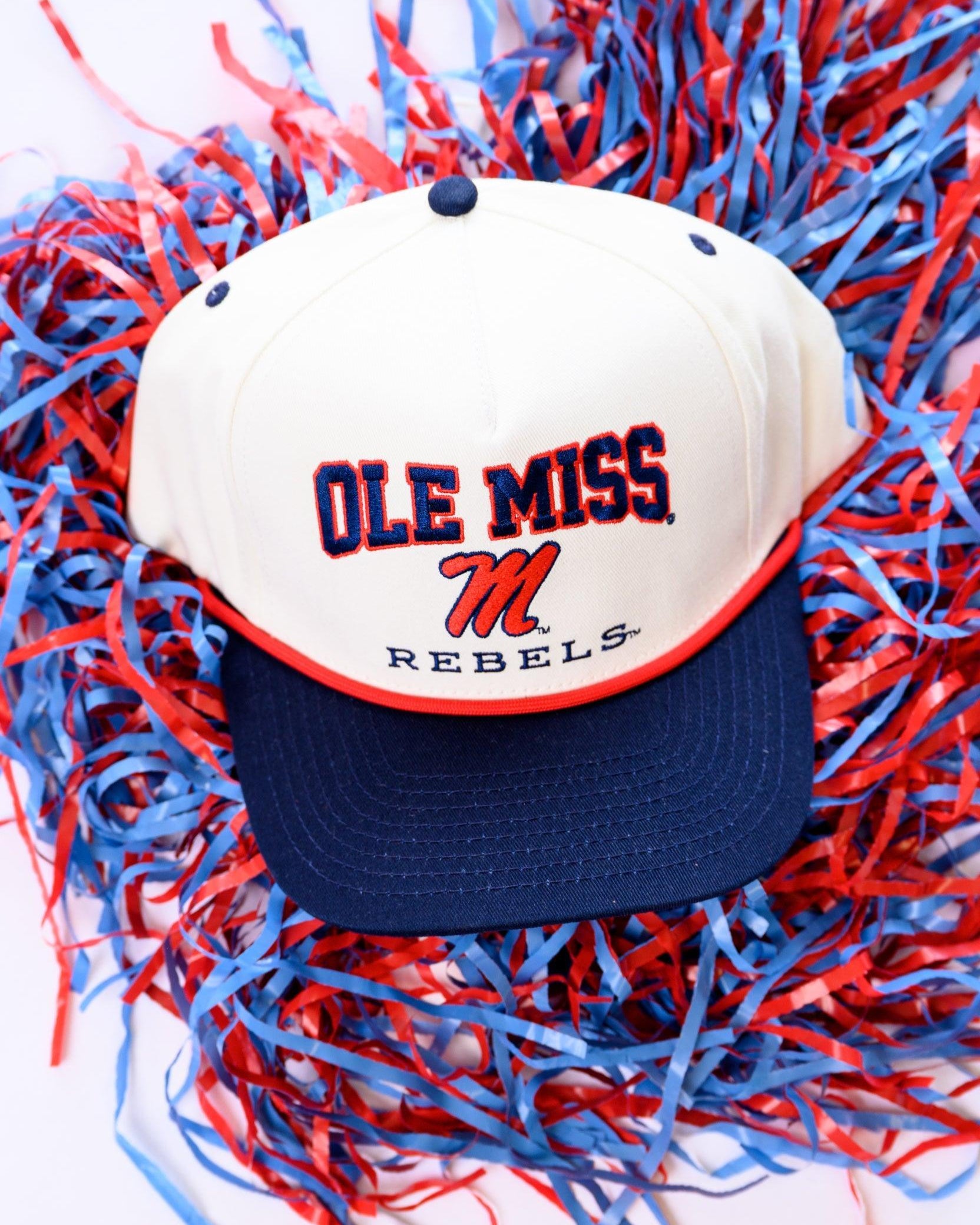 Ole Miss Cream and Navy Hat with embroidered text “Ole Miss Rebels” surrounding the Script M Logo