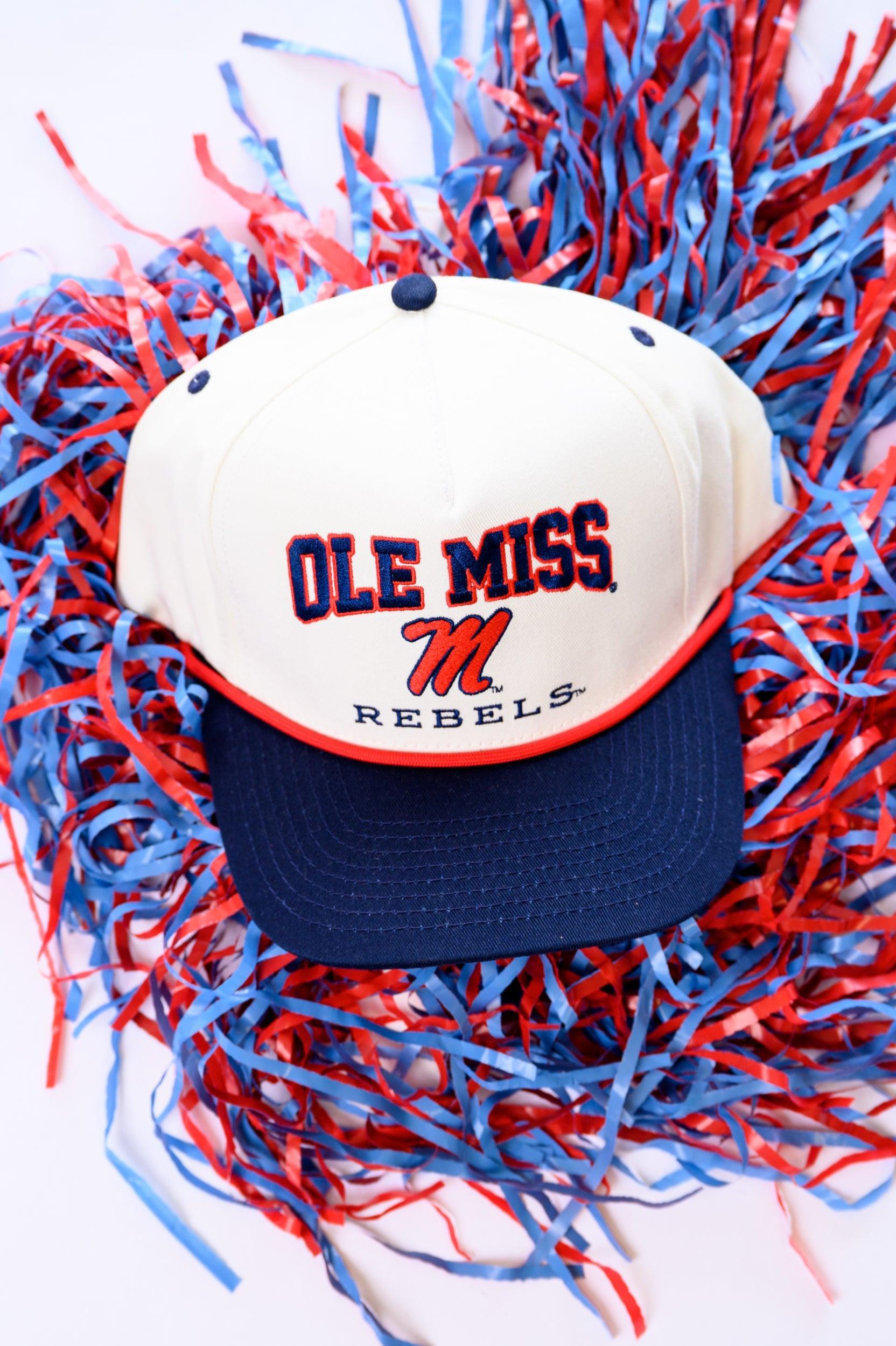 Ole Miss Cream and Navy Hat with embroidered text “Ole Miss Rebels” surrounding the Script M Logo