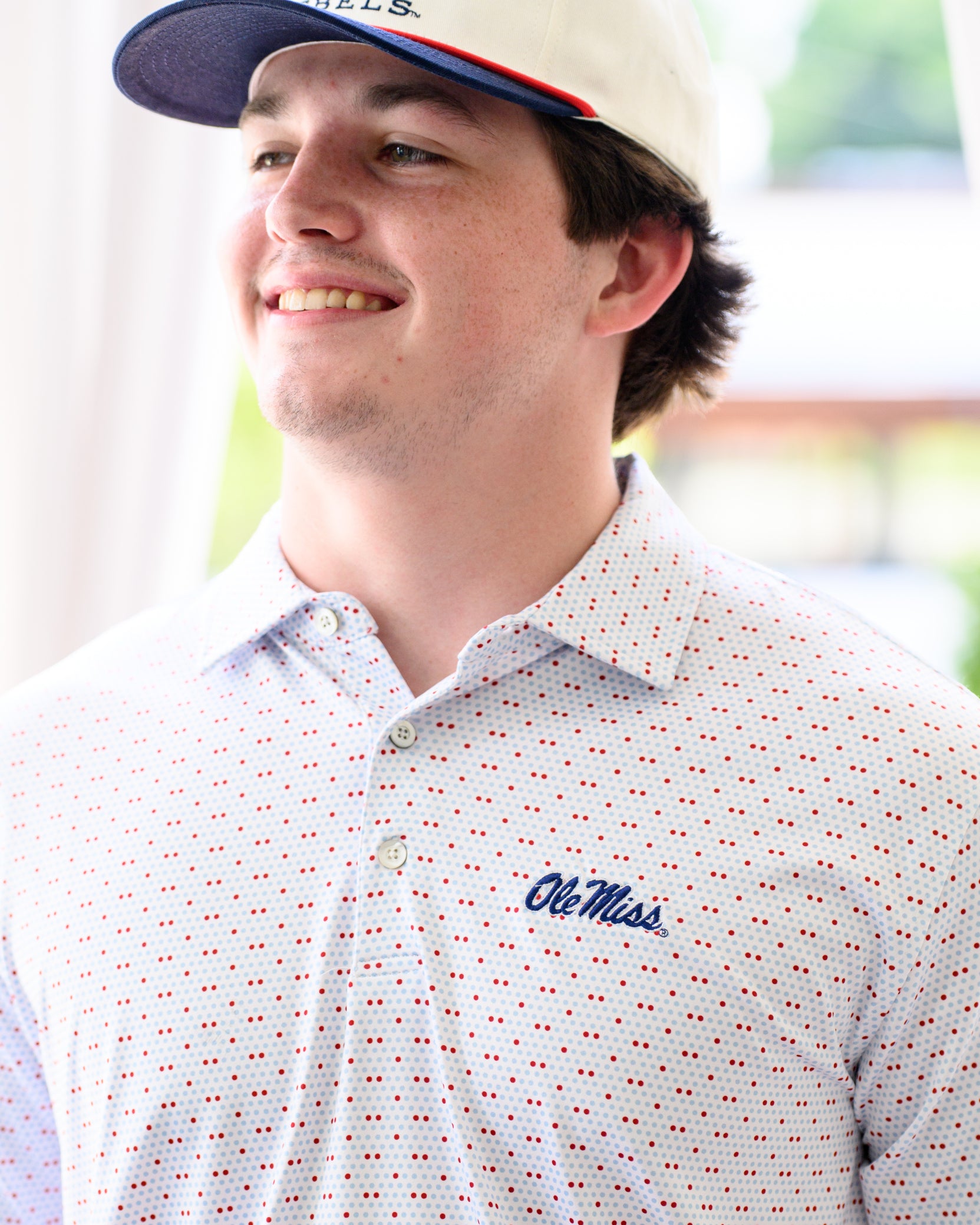 Ole Miss White Men’s Polo with Red and Light Blue dots and Navy Ole Miss Logo embroidery