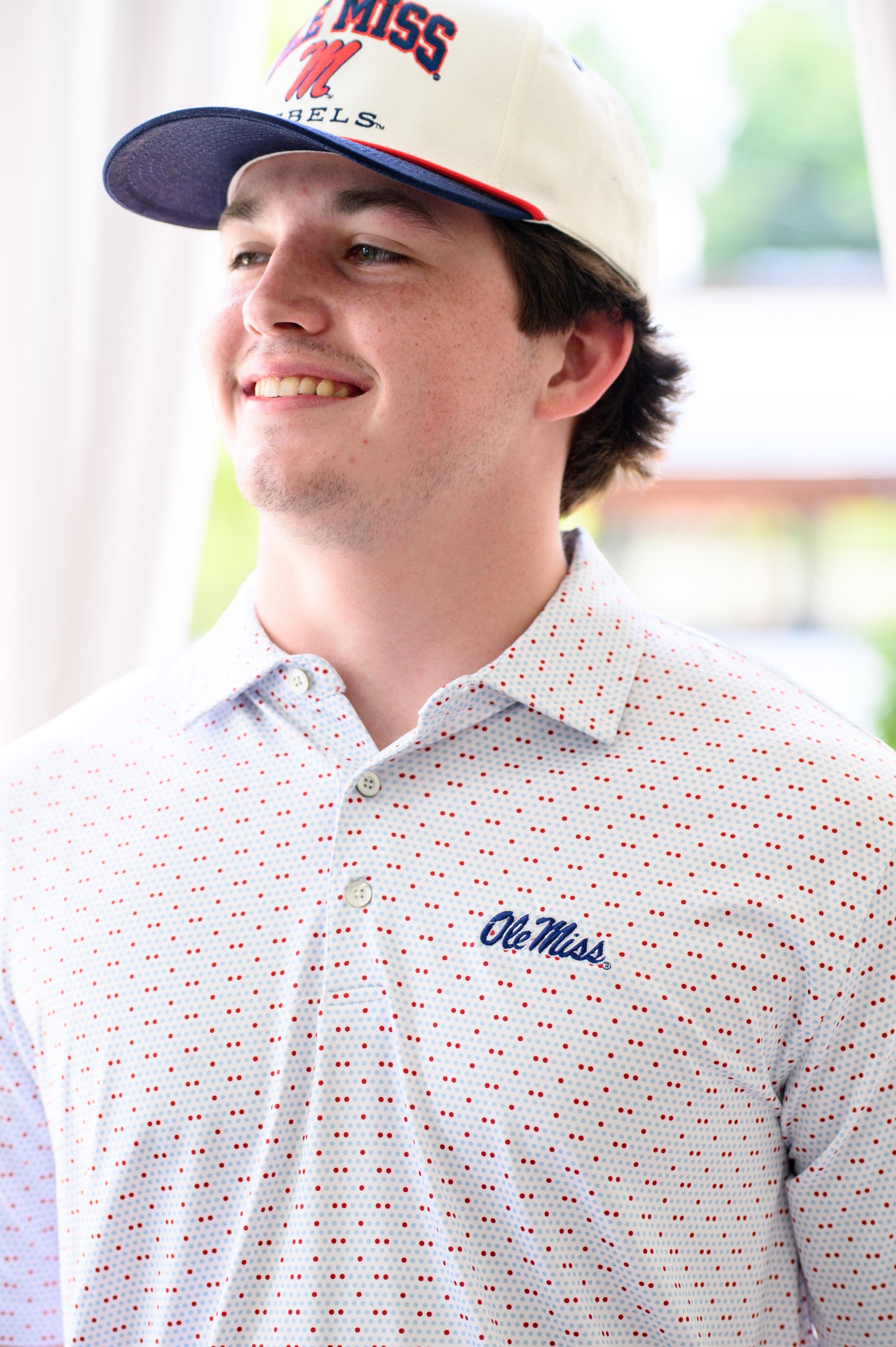 Ole Miss White Men’s Polo with Red and Light Blue dots and Navy Ole Miss Logo embroidery