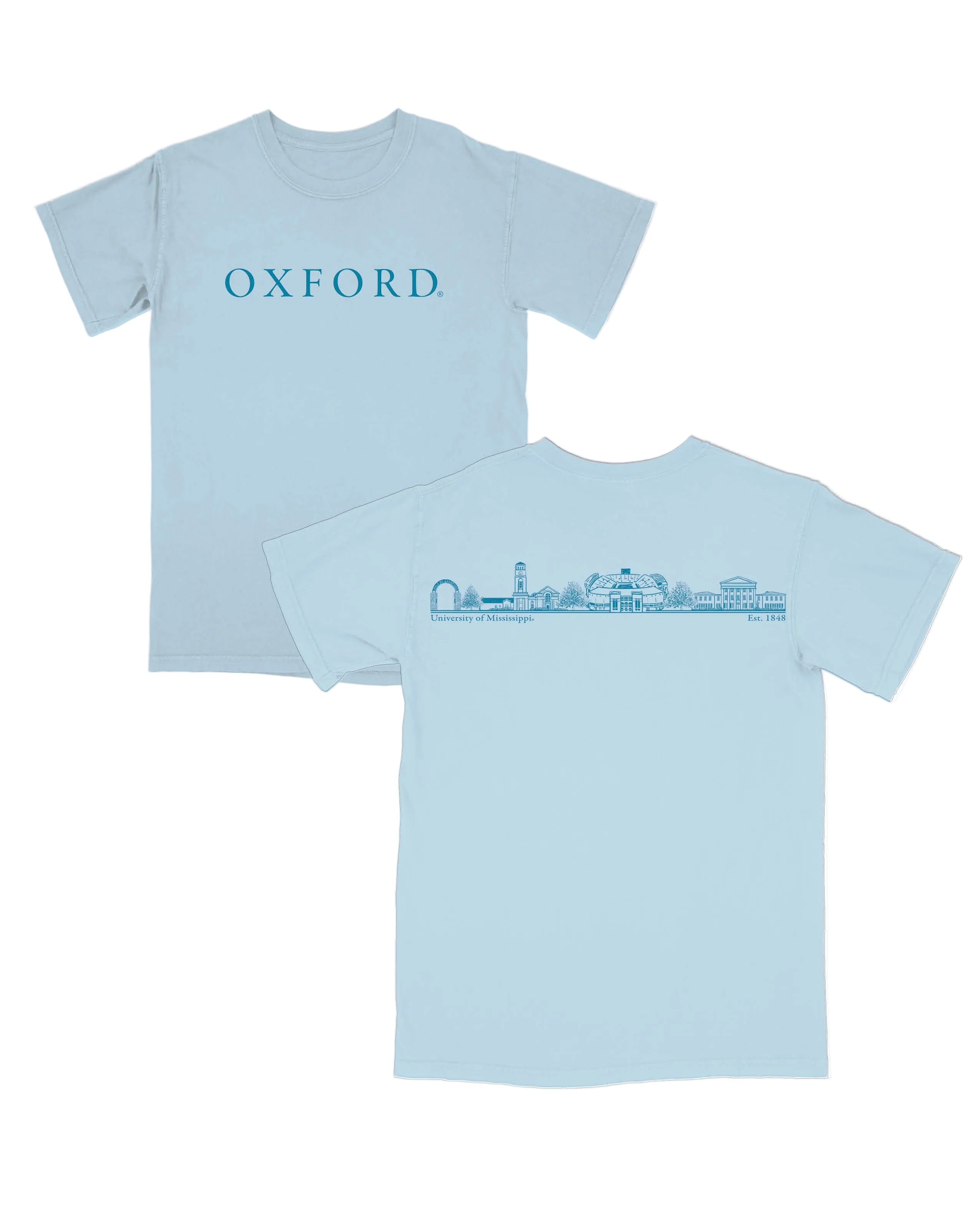 Ole Miss Light Blue T-Shirt with Electric Blue Text on the front, “OXFORD.” The Back features sketches of Oxford Icons such as the Walk of Champions Gate, The Vaught stadium, and the Lycrum