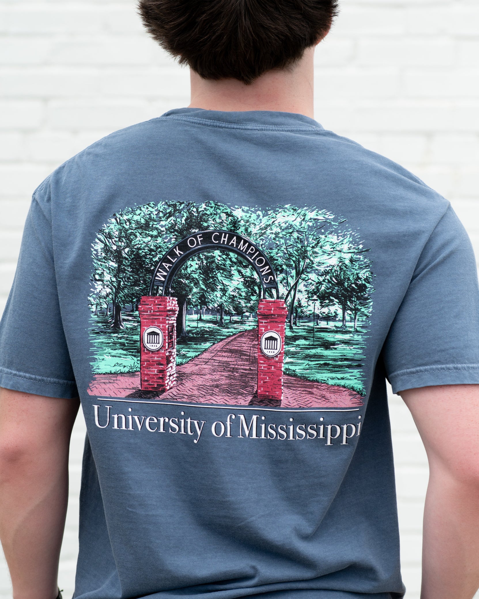 Ole Miss Dusty Navy T-Shirt with an illustration of the Mississippi University Walk of Champions