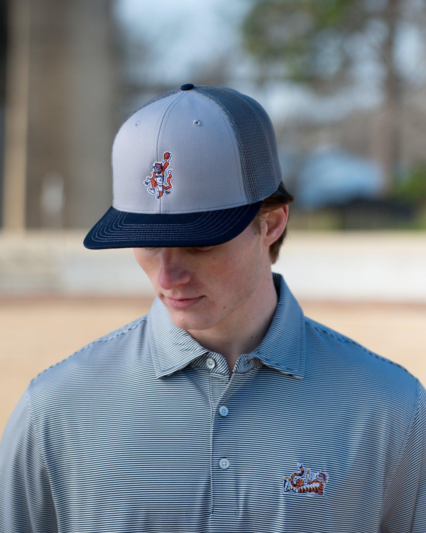 Auburn University Grey and Navy Trucker Hat with the Original Aubie basketball logo on the front, featuring a gray crown and black visor.