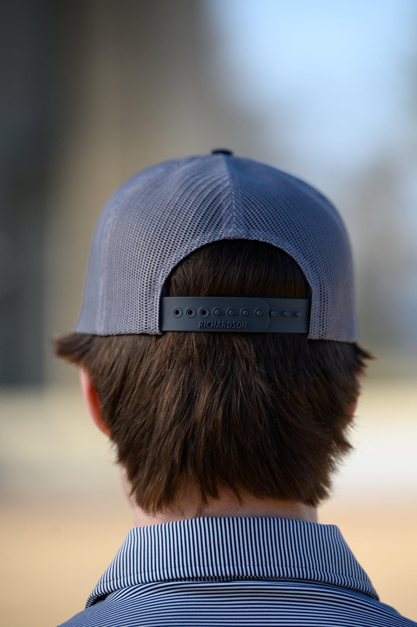 Auburn University Grey and Navy Trucker Hat with the Original Aubie basketball logo on the front, featuring a gray crown and black visor.