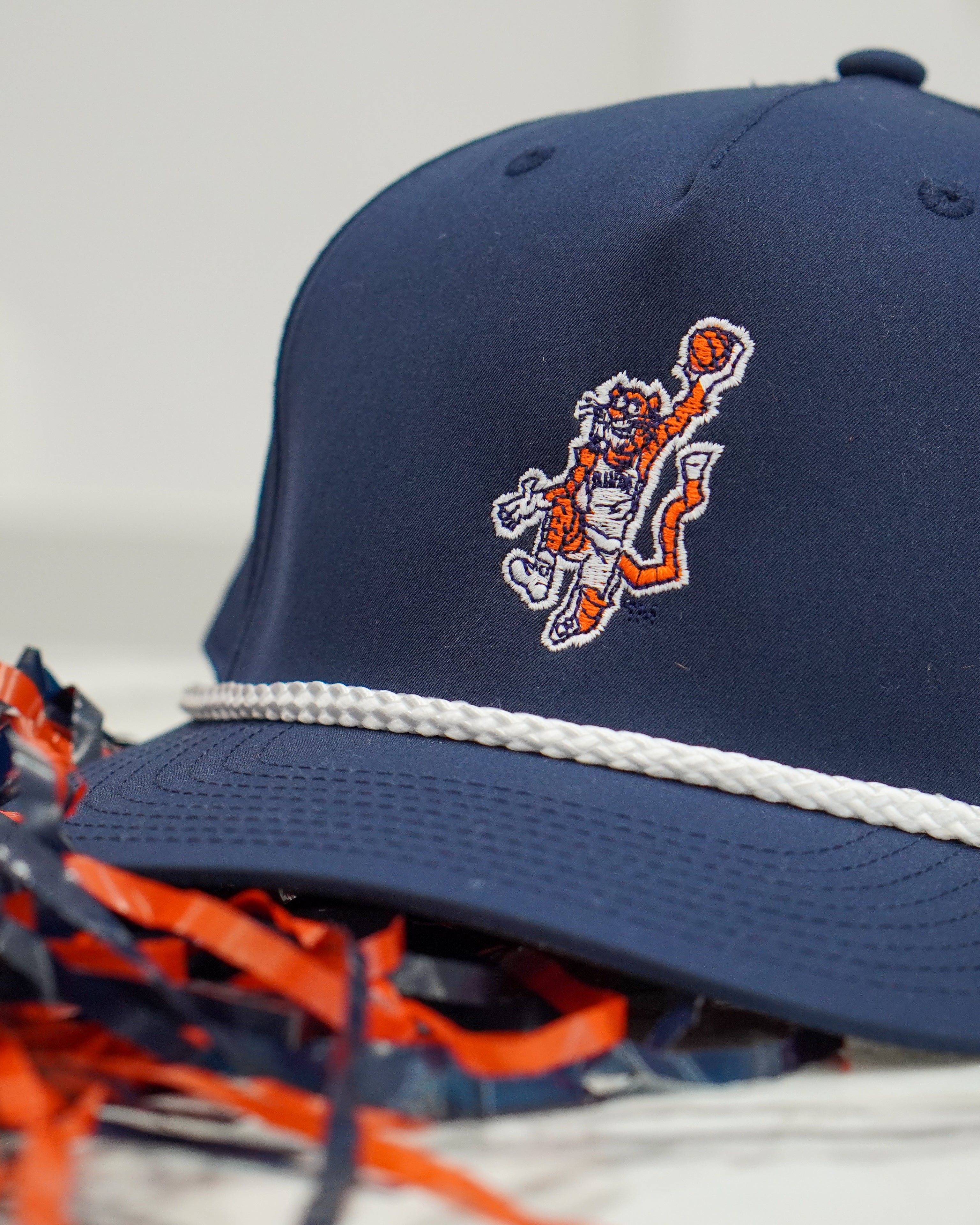 Auburn University Navy Hat with a White Rope and a patch or the Original Aubie dunking a Basketball