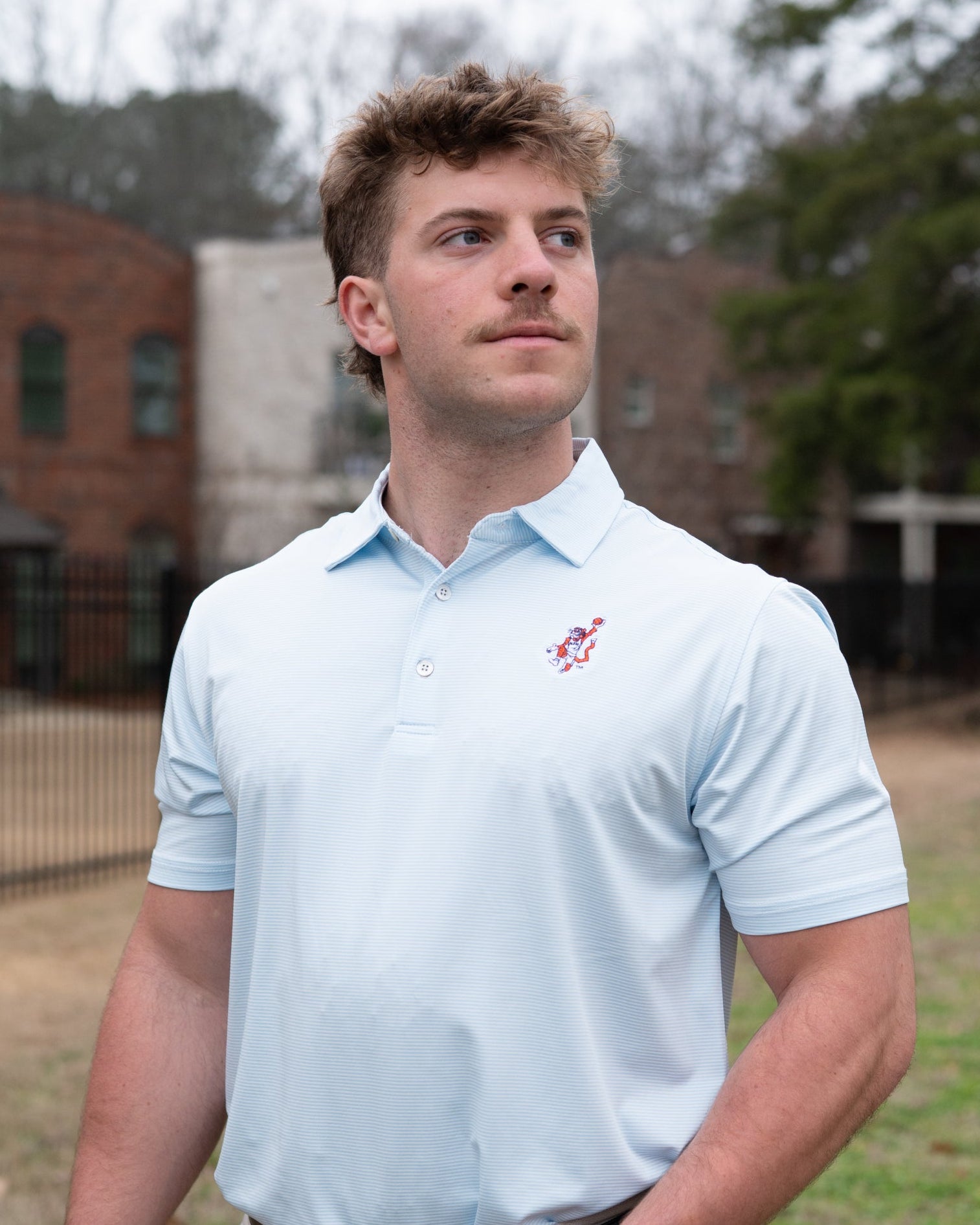Auburn University Light Blue Men’s Stripe Polo with the Original Aubie Basketball Logo embroidery