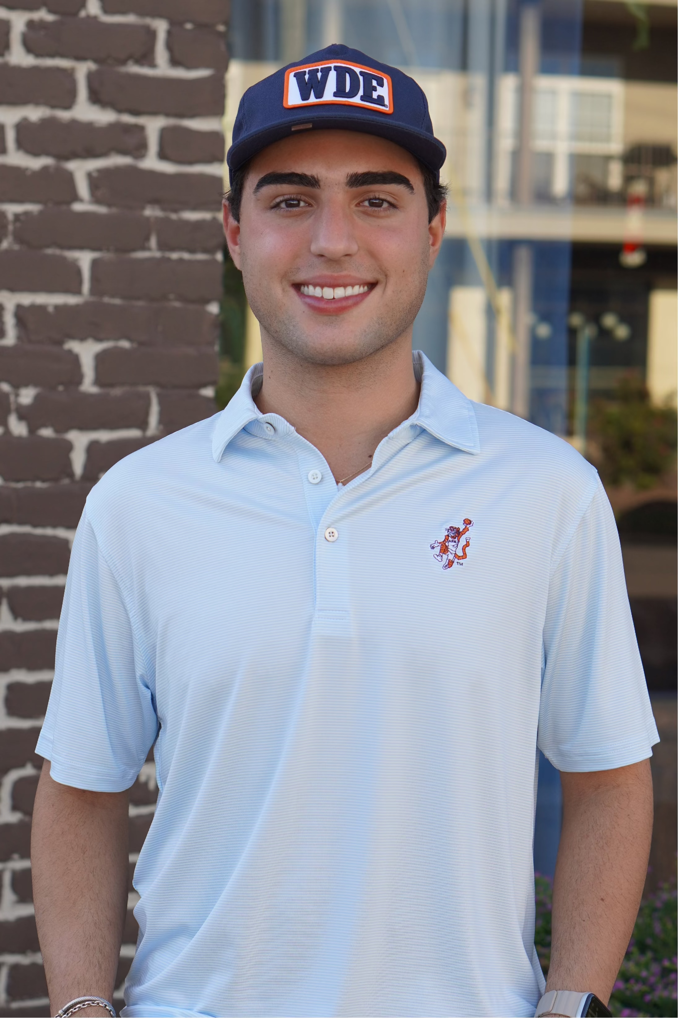 Auburn University Light Blue Men’s Stripe Polo with the Original Aubie Basketball Logo embroidery