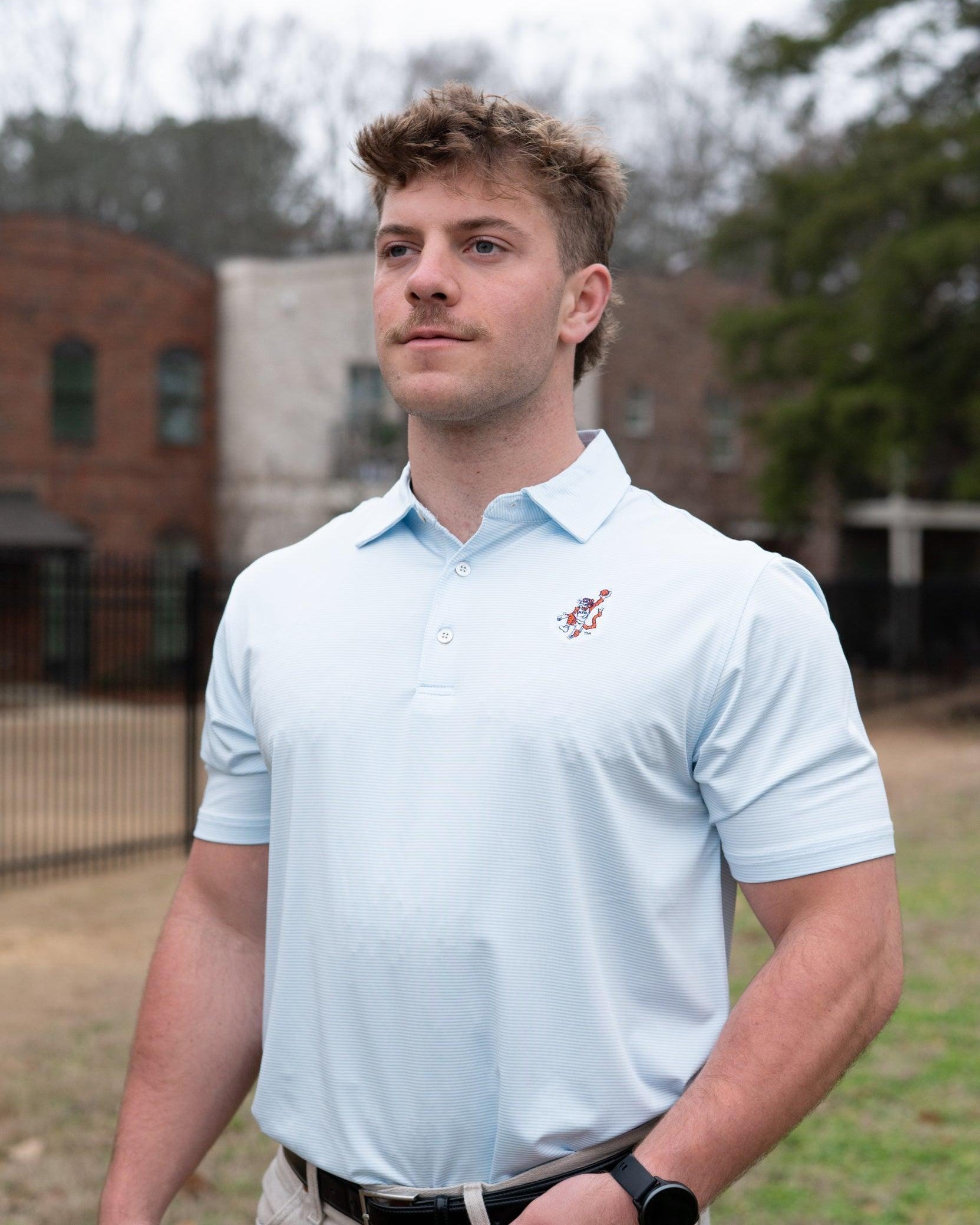 Auburn University Light Blue Men’s Stripe Polo with the Original Aubie Basketball Logo embroidery
