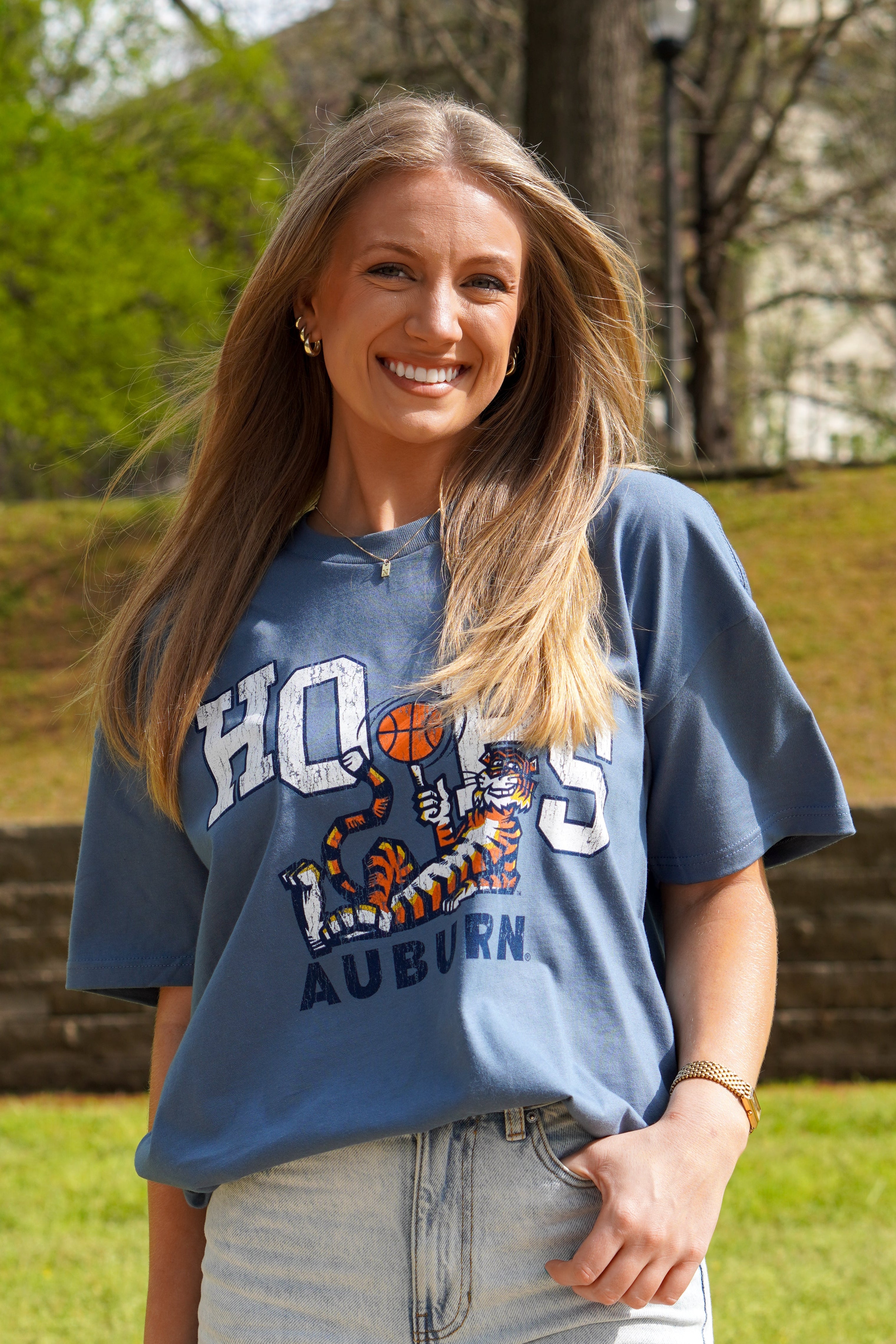 Auburn University Blue T-Shirt with the Original Aubie lounging beneath the word "Hoops" and holding a basketball in place of the second "O"