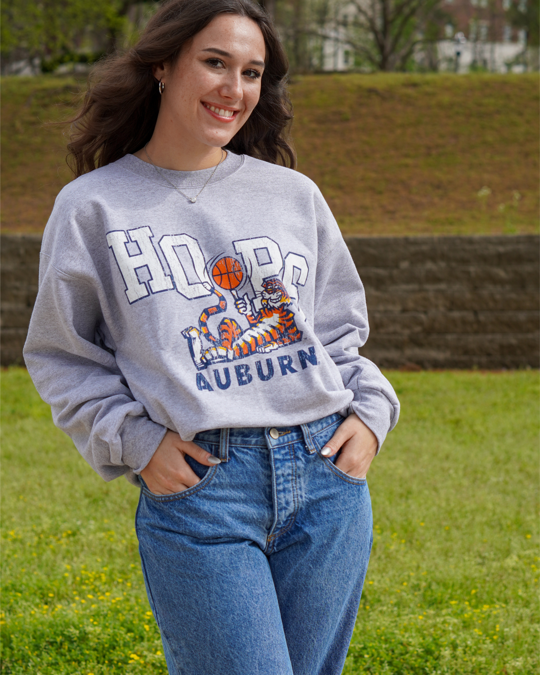 Auburn University Grey Sweatshirt with the Original Aubie lounging beneath the word "Hoops" and holding a basketball in place of the second "O"