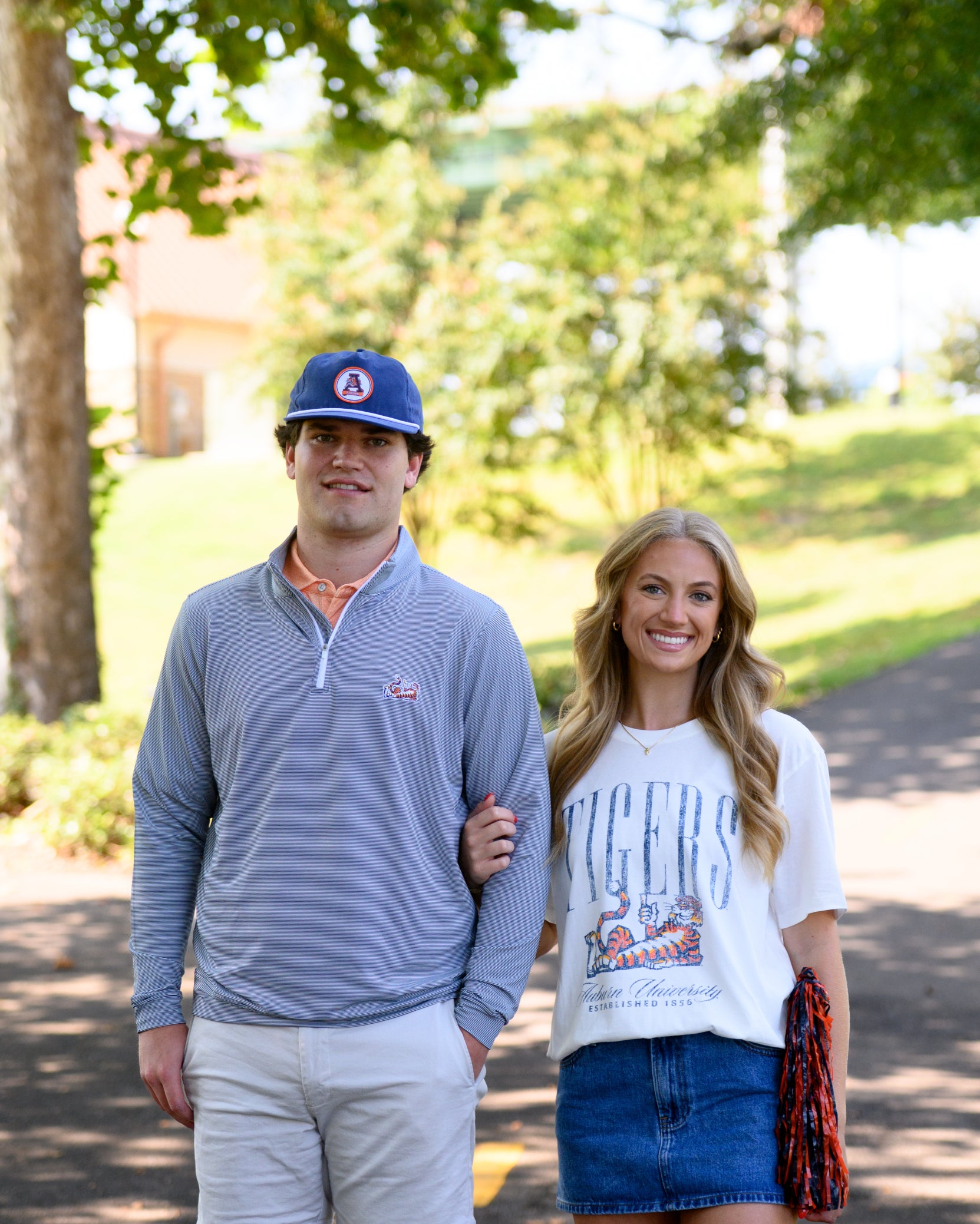 Auburn University Ivory T-Shirt with navy text “Tigers” above Aubie laying down