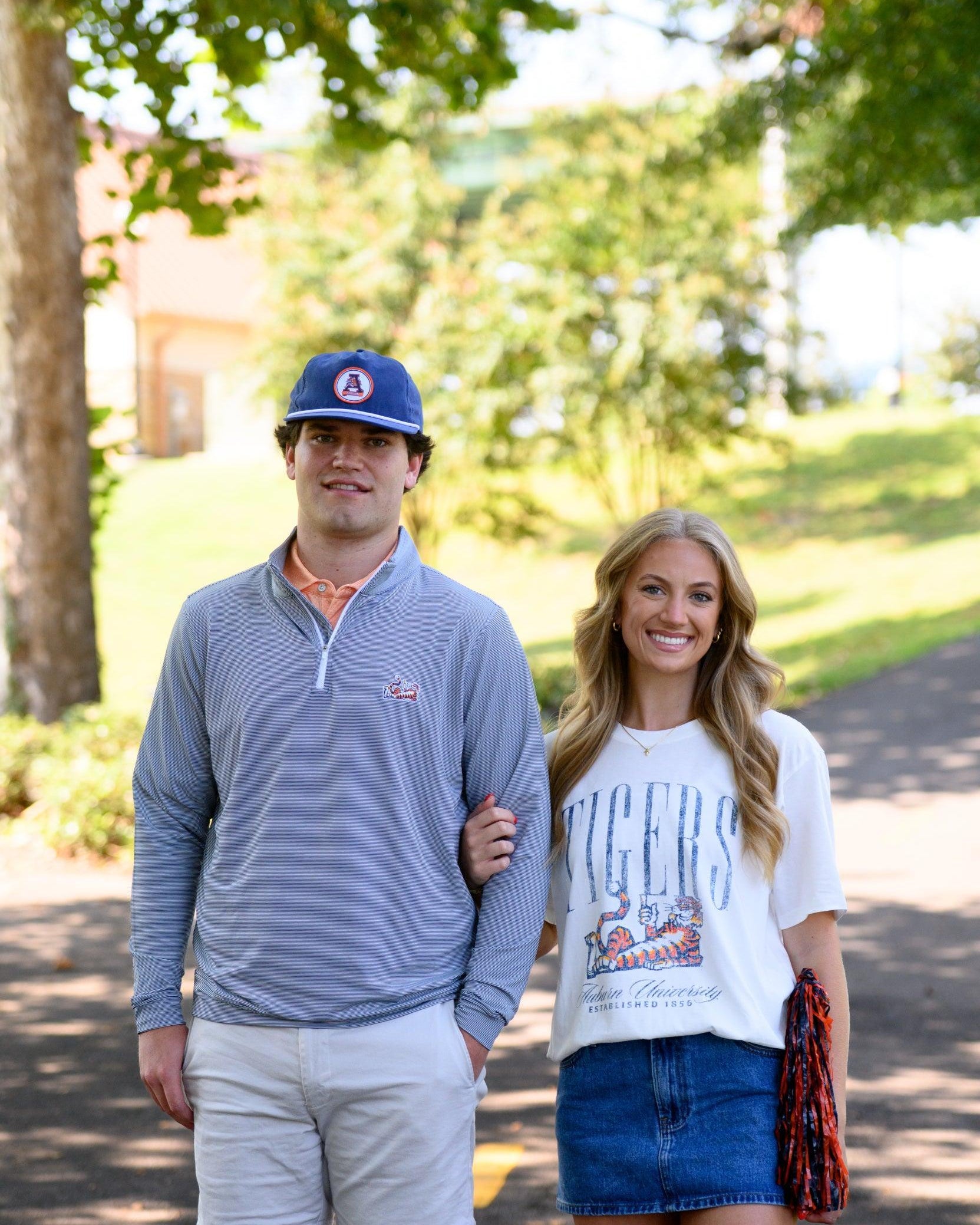 Auburn University Ivory T-Shirt with navy text “Tigers” above Aubie laying down