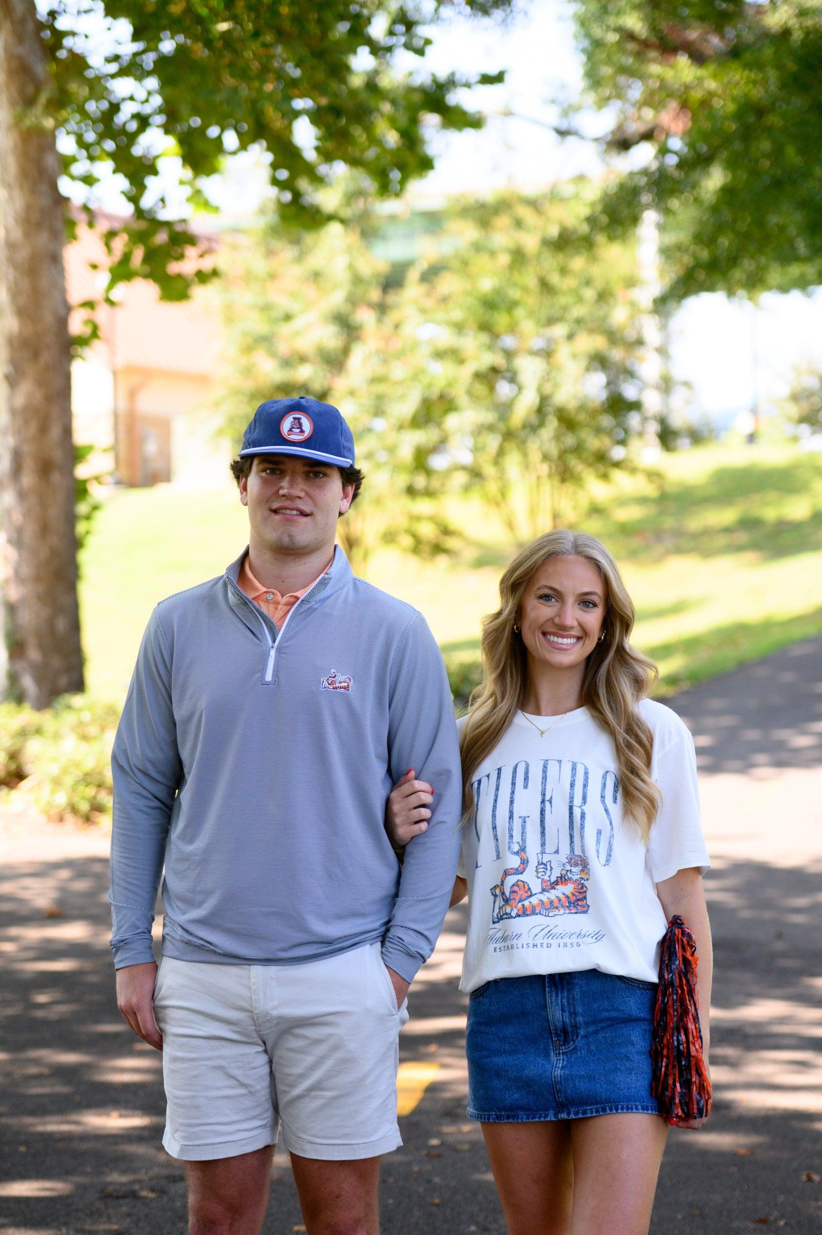 Auburn University Ivory T-Shirt with navy text “Tigers” above Aubie laying down