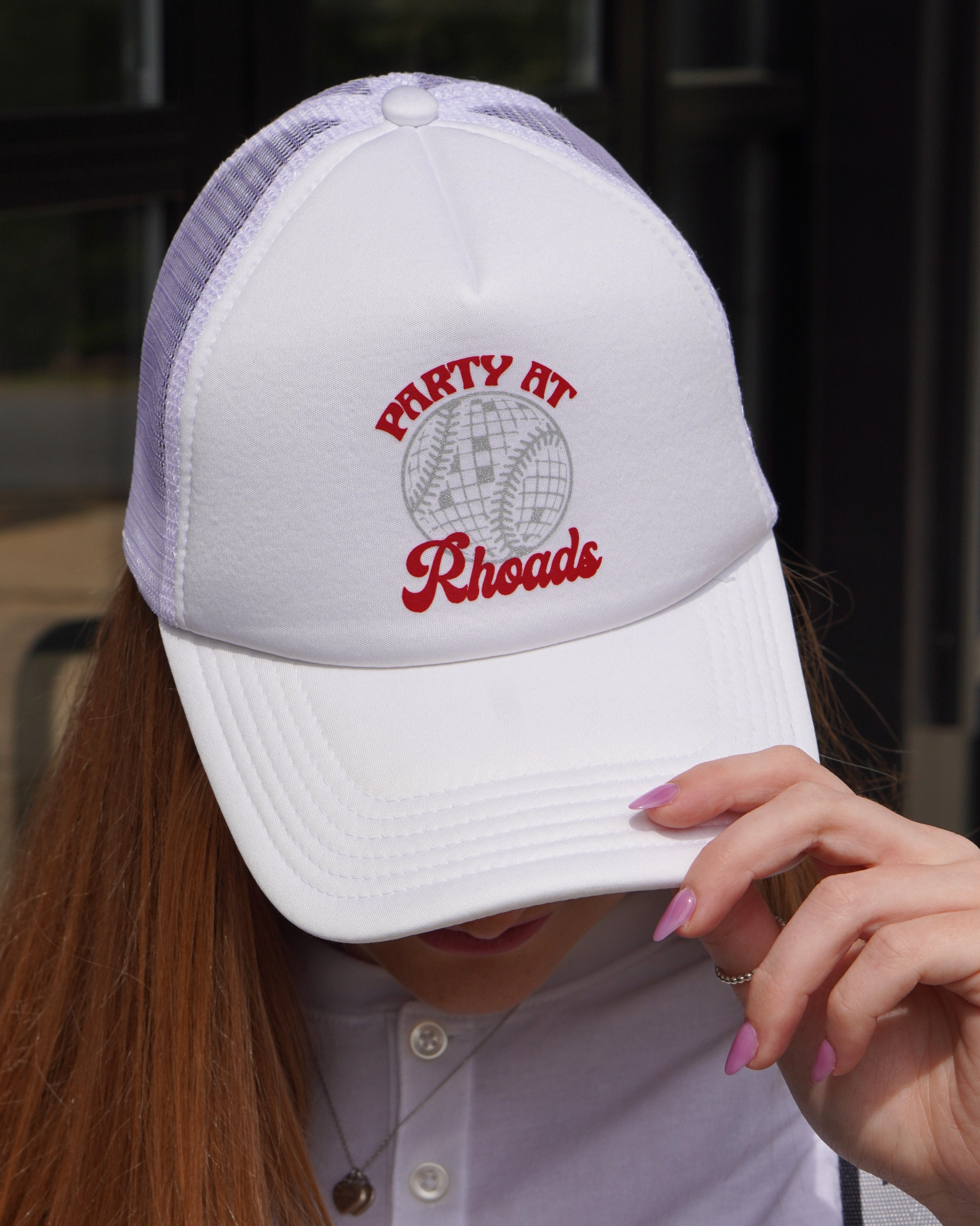 University of Alabama White Trucker Hat with 'Party At Rhoads' text and a disco softball design in silver and crimson.